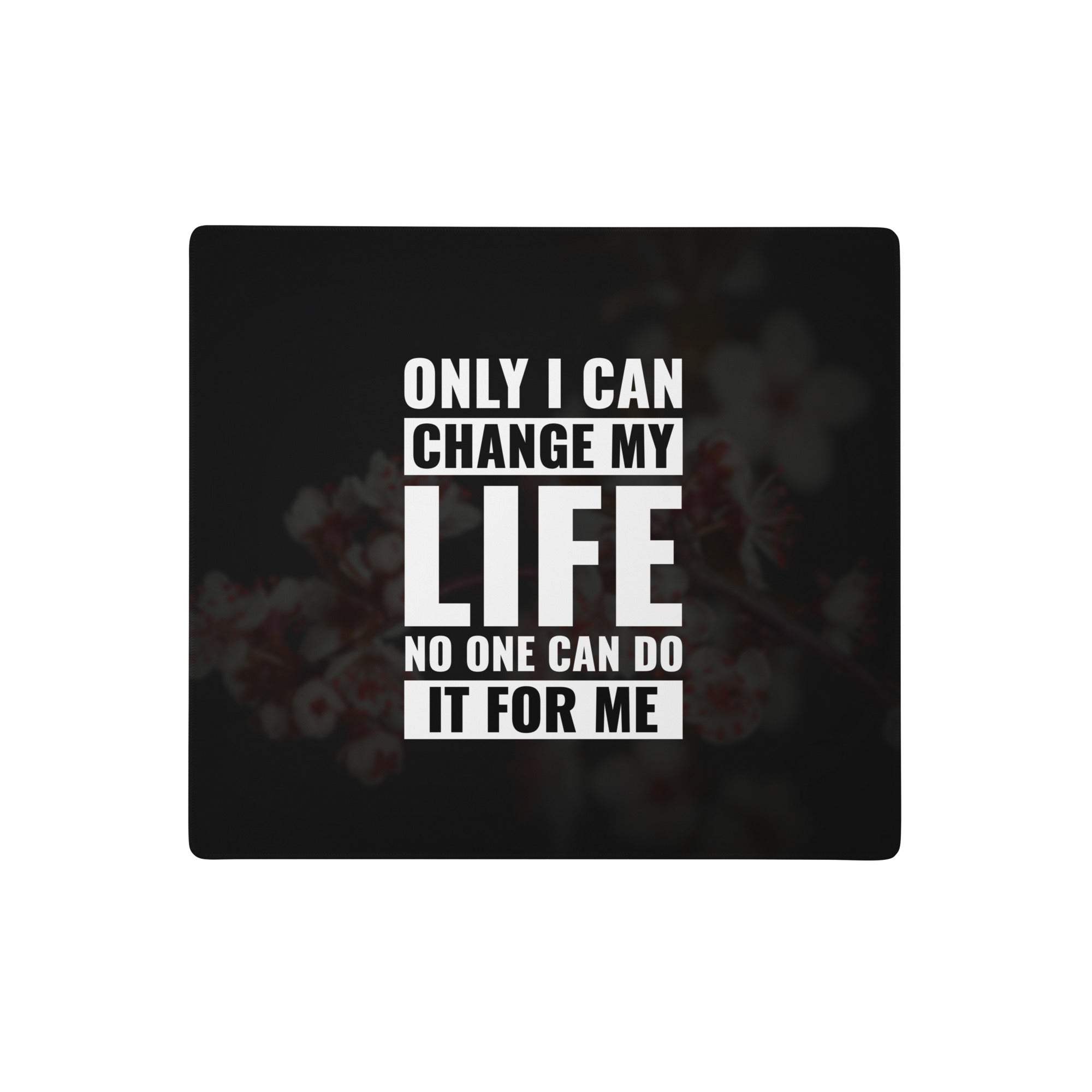 Black rectangular motivational quote mouse pad with bold white text and subtle floral background print