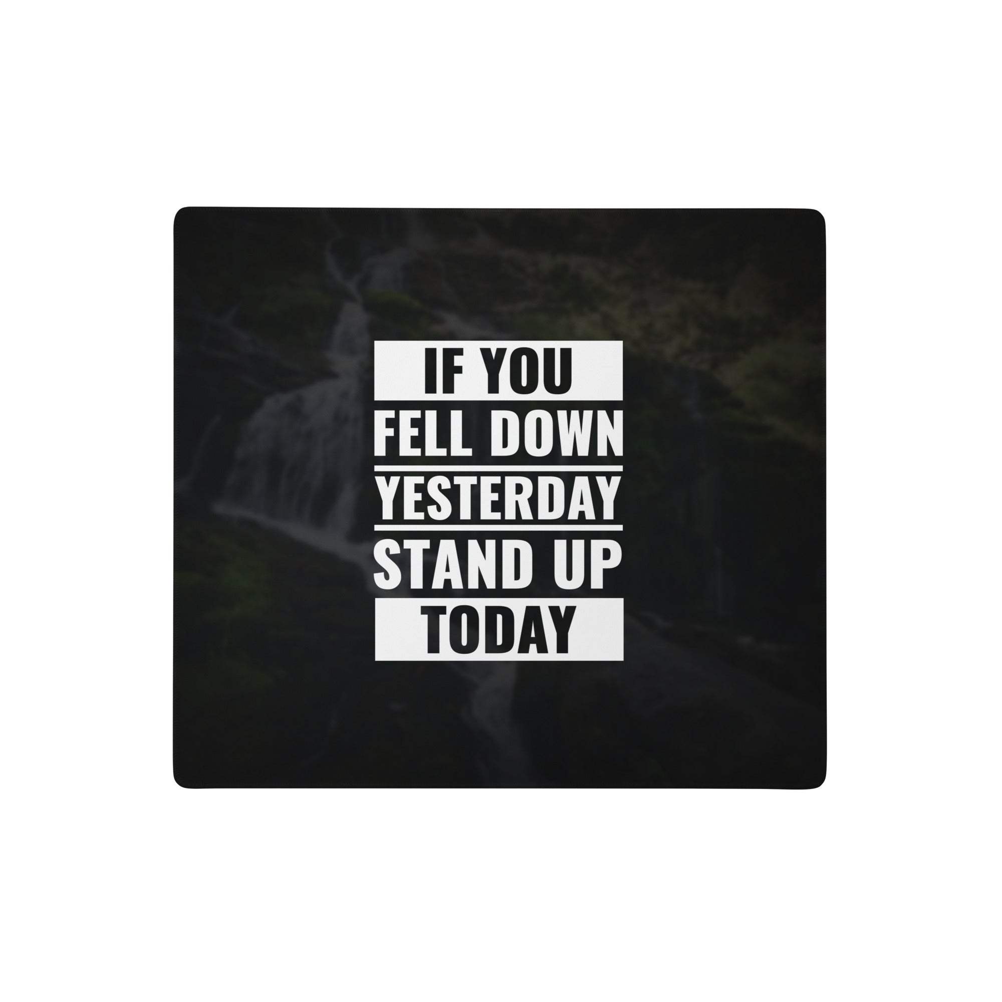 Black rectangular mousepad with bold white motivational quote over dark blurred waterfall background for gaming and work