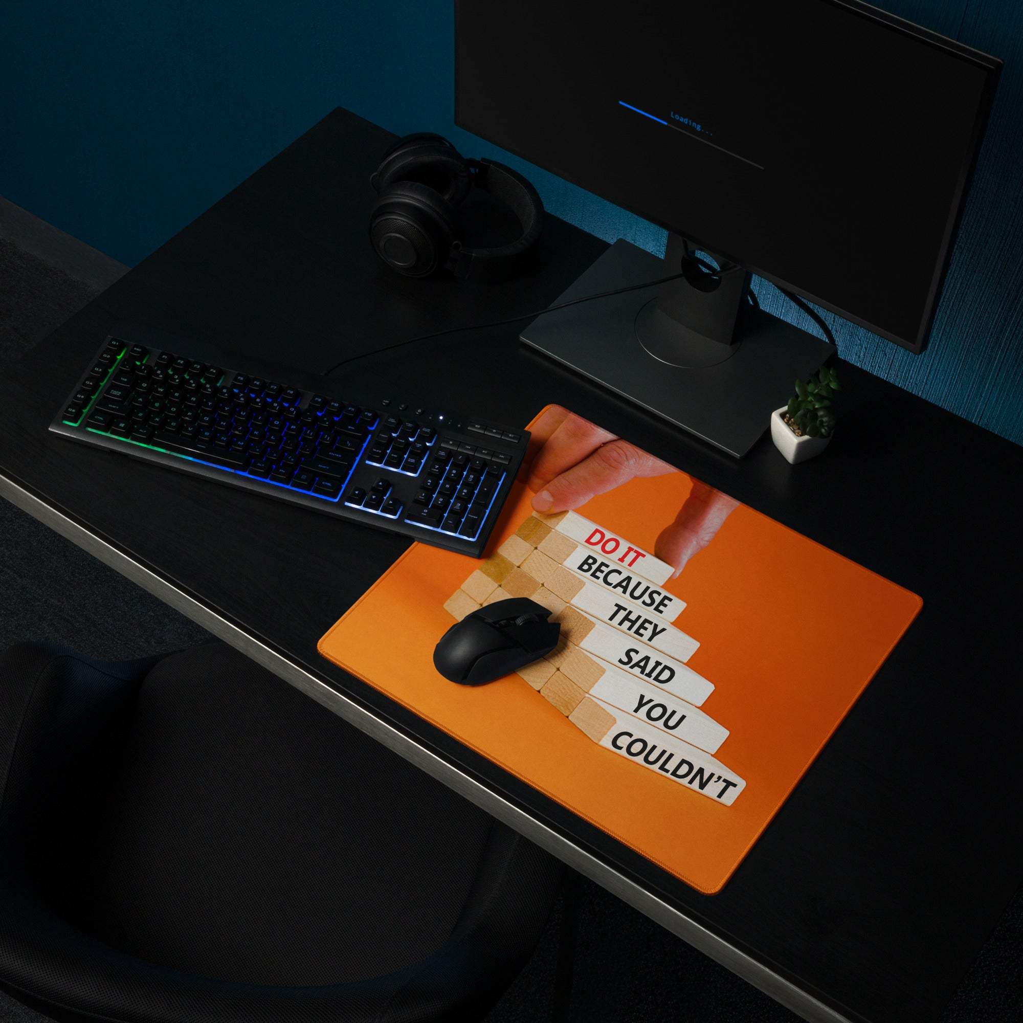 Bold orange motivational mouse pad with stacked white and red rectangular blocks design for modern office use
