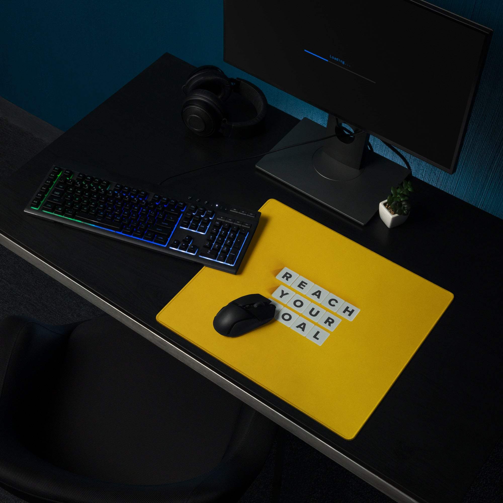 Bright yellow rectangular motivational desk pad with reach your goal printed in white letter tiles non slip office decor