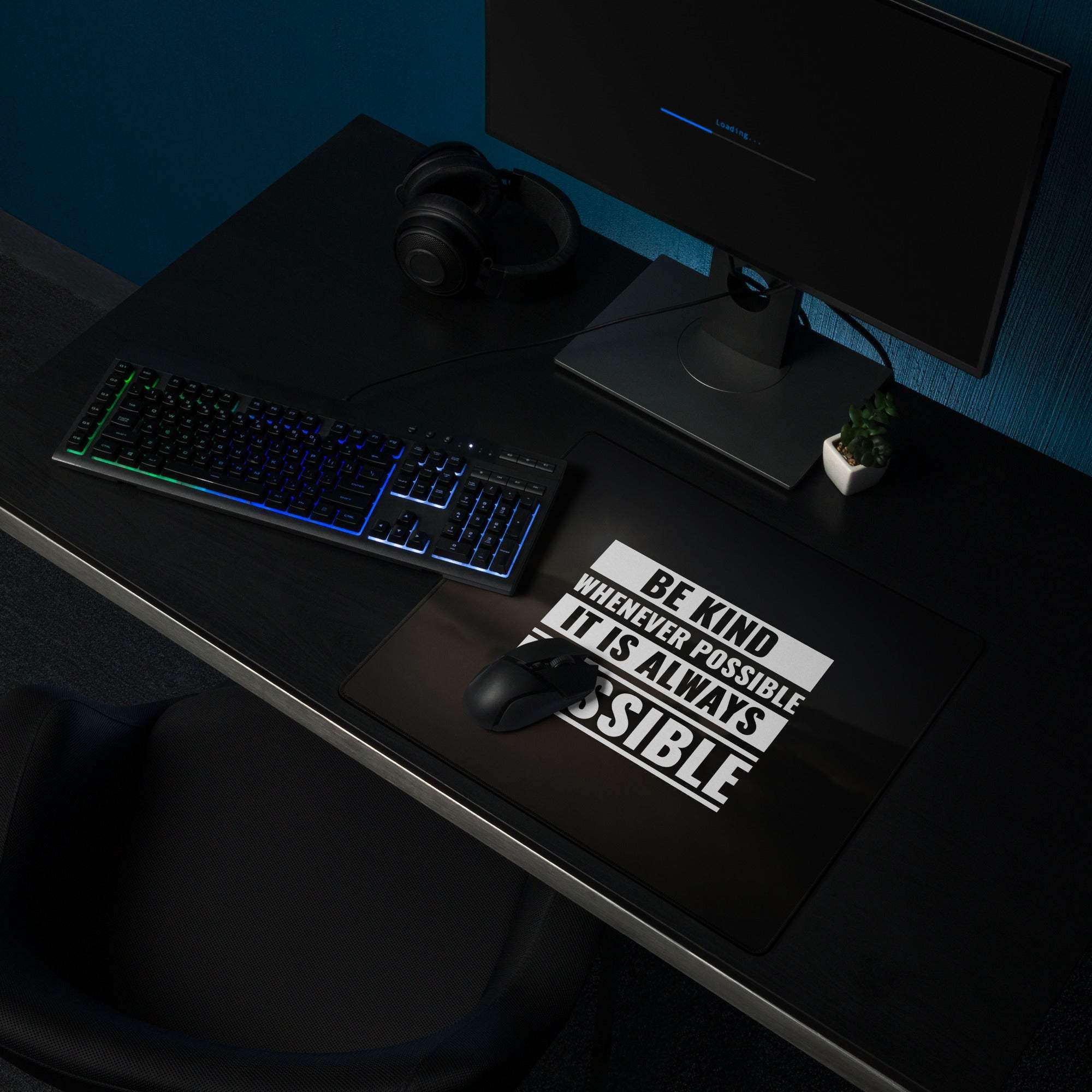 Black large gaming mouse pad with white motivational typography print be kind whenever possible on minimalist desk decor