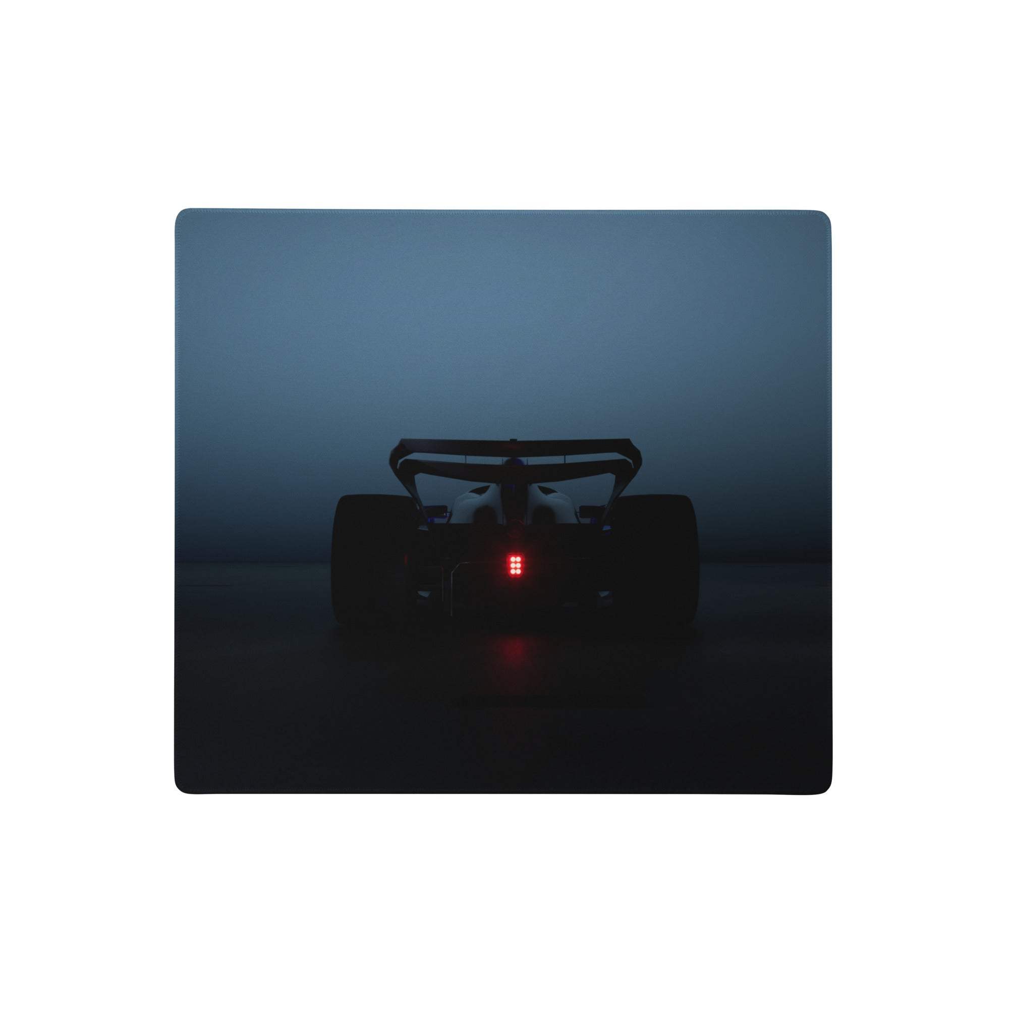A sleek dark blue rectangular midnight racer mouse pad with a minimalist formula 1 silhouette and glowing red taillights