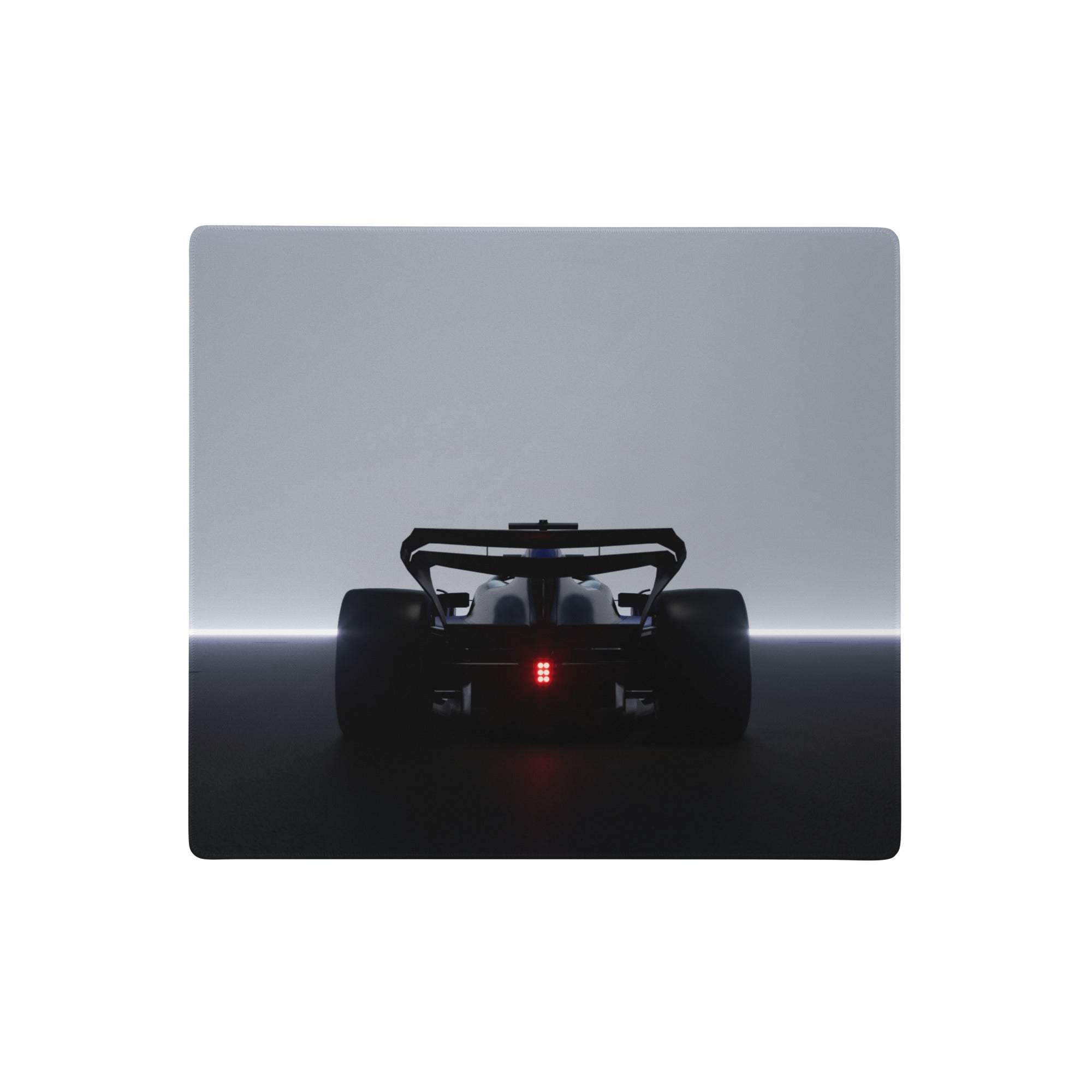 Large gray gaming mouse pad with stitched edge non slip base featuring a matte black formula 1 car silhouette switch plate