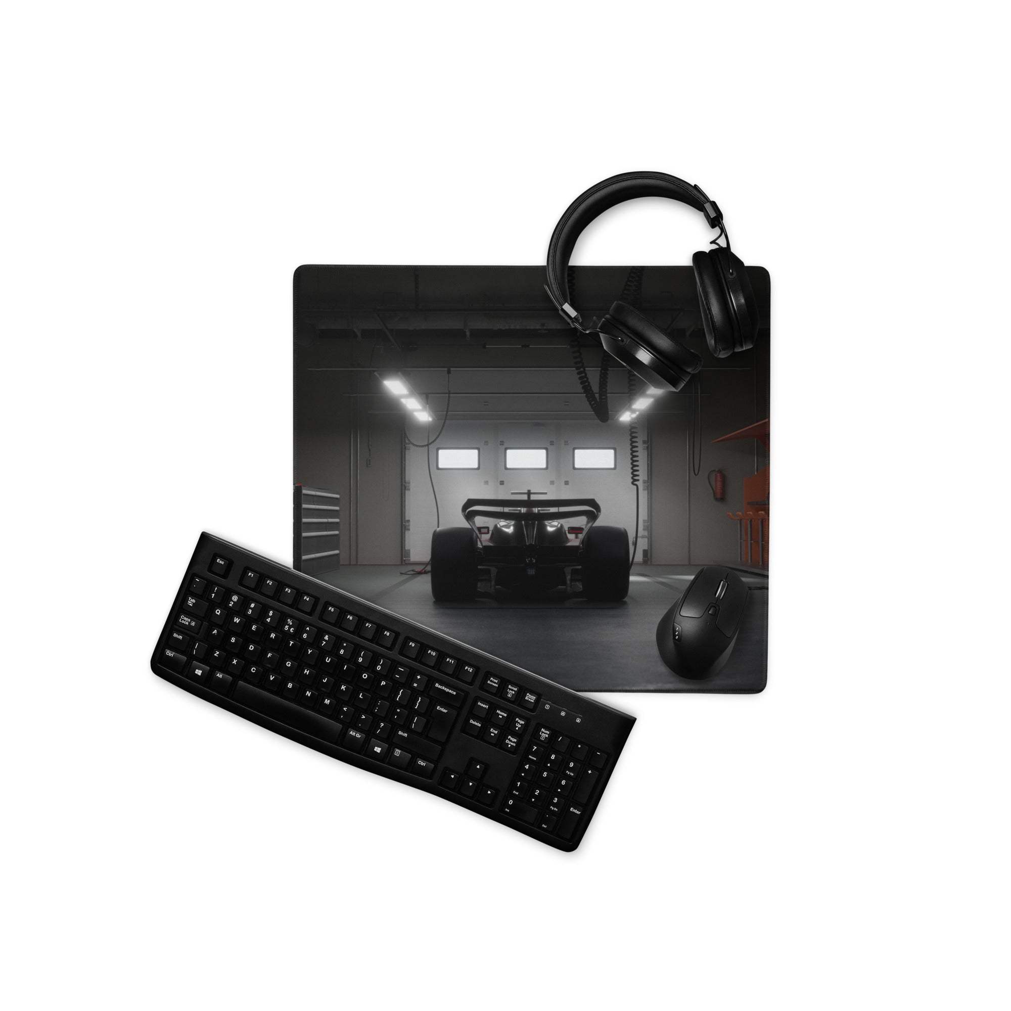 Black rectangular gaming mouse pad with non slip edge stitch and monochrome formula 1 race car photo print
