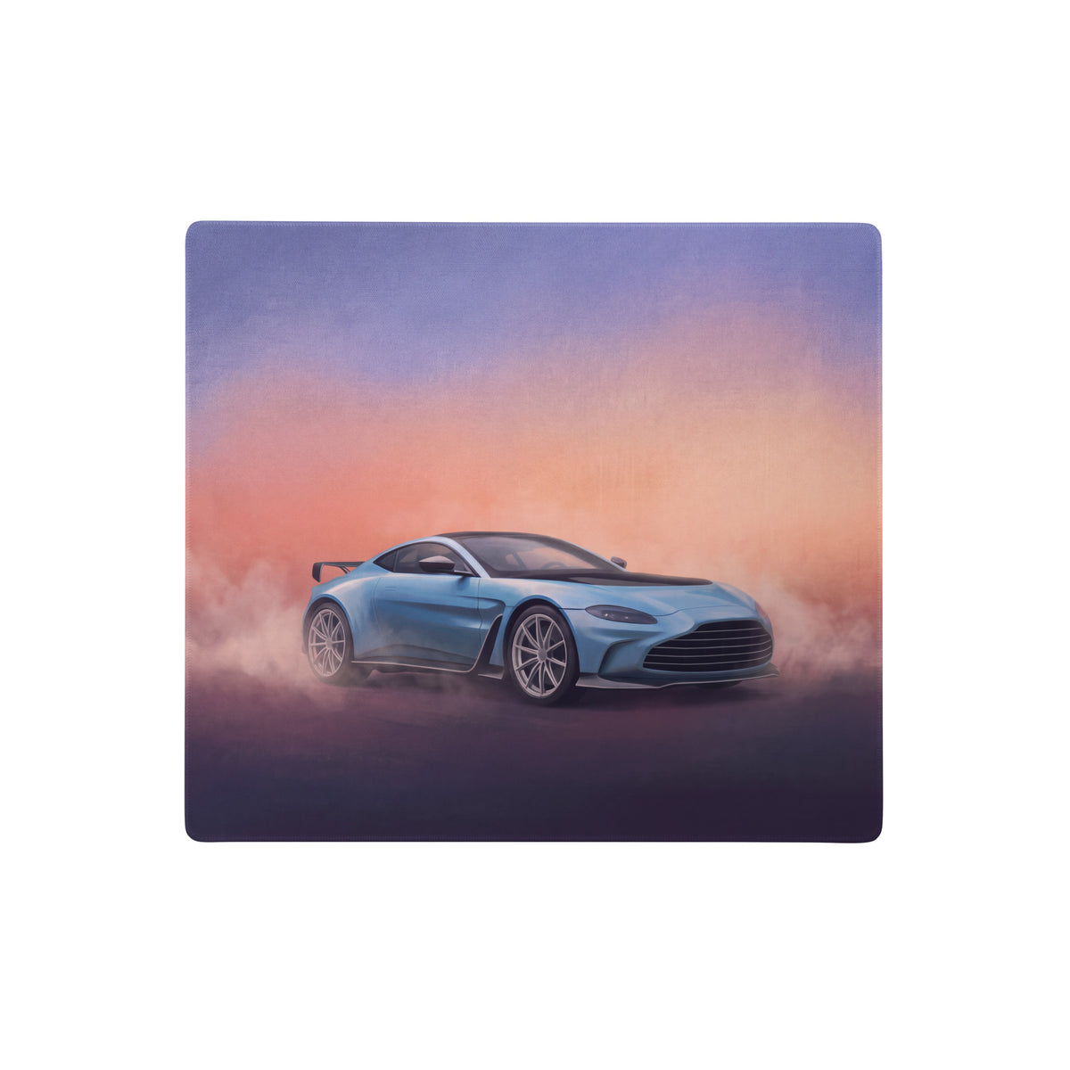 Aaston martin vantage inspired sky blue gt3 desk pad featuring a light blue aston martin drifting against a sunset sky