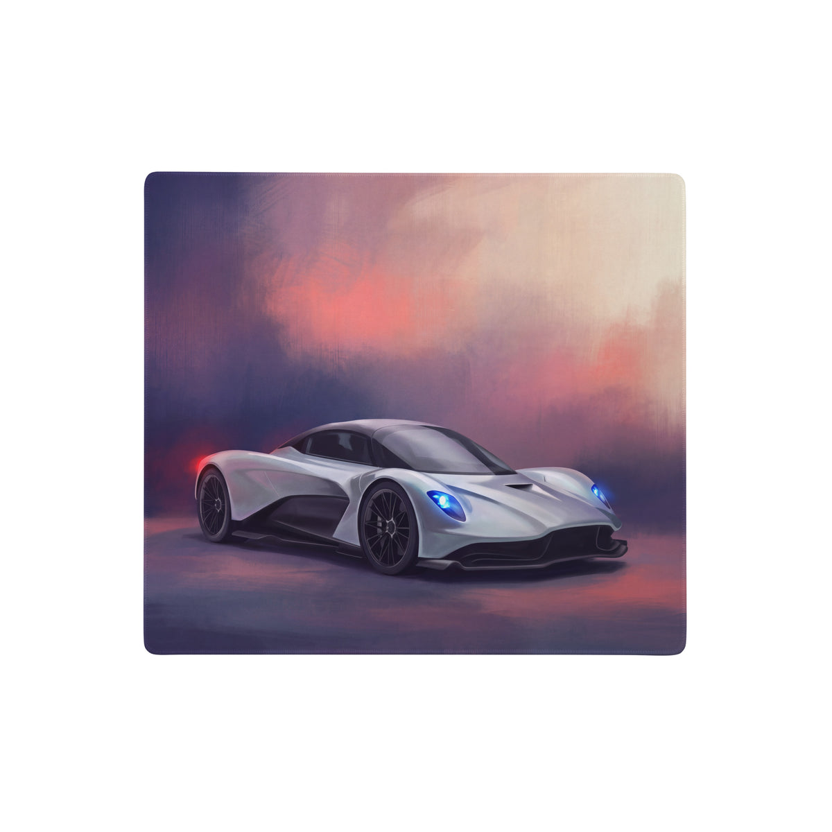 Silver aston martin valkyrie inspired aero desk mat with glowing blue headlights and black accents for pc setup