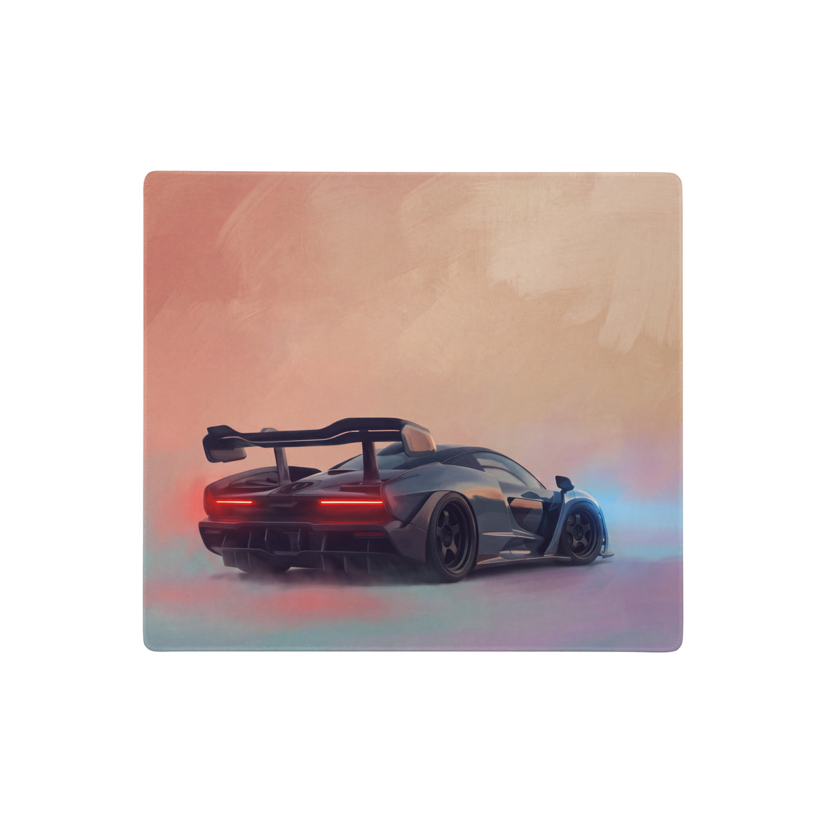 McLaren Senna inspired stealth edition desk pad featuring a sleek black sports car with rear spoiler on rubber base