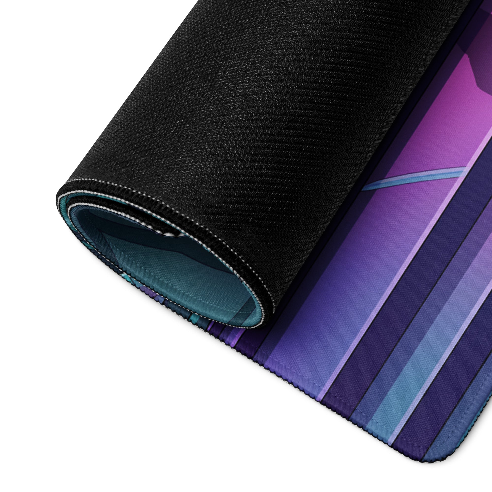 A rolled-up vaporwave neon forest gaming mouse pad with a purple blue teal gradient design for cyberpunk desks