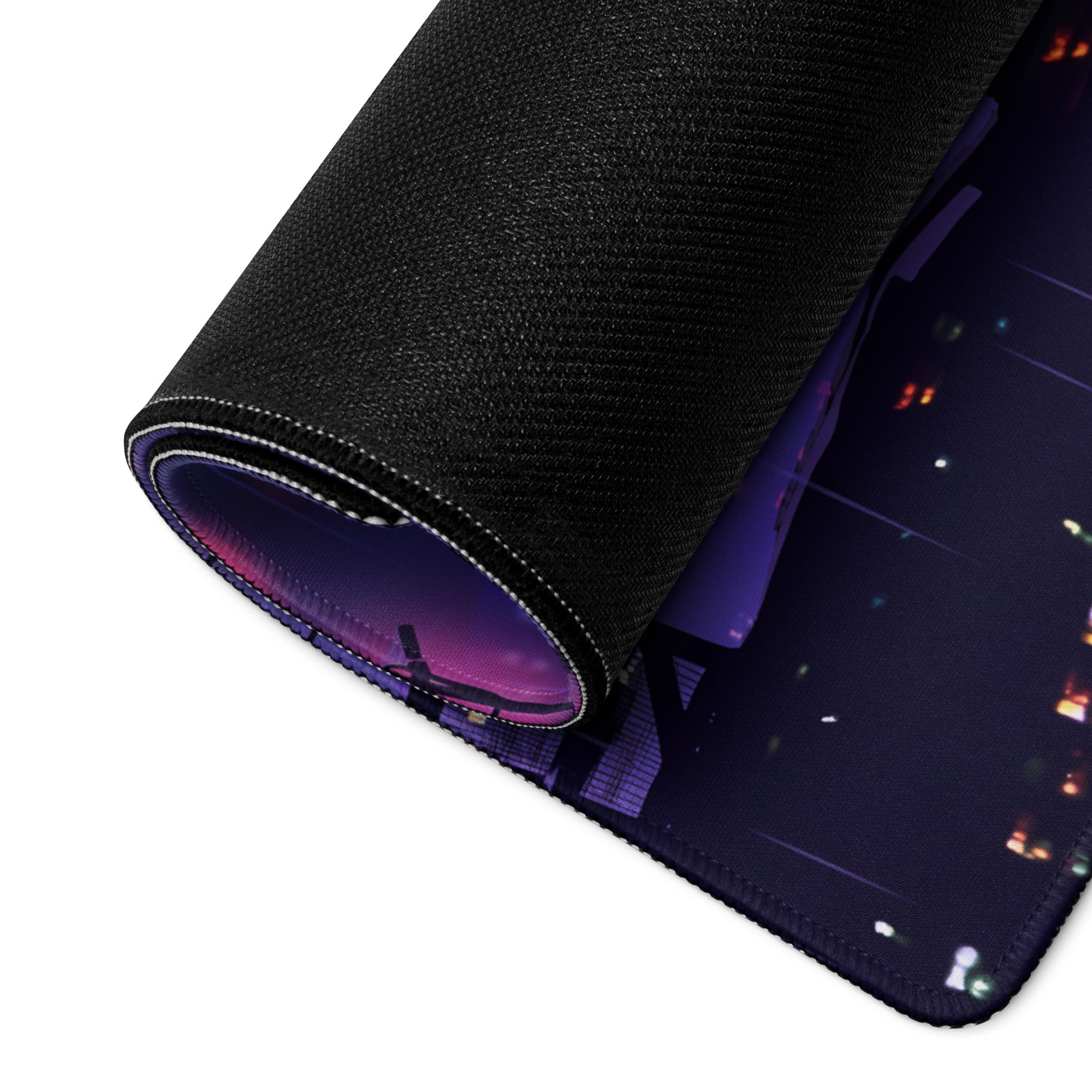 Black textured mousepad with rolled edge and neon blue purple vaporwave cityscape design for gaming desk use