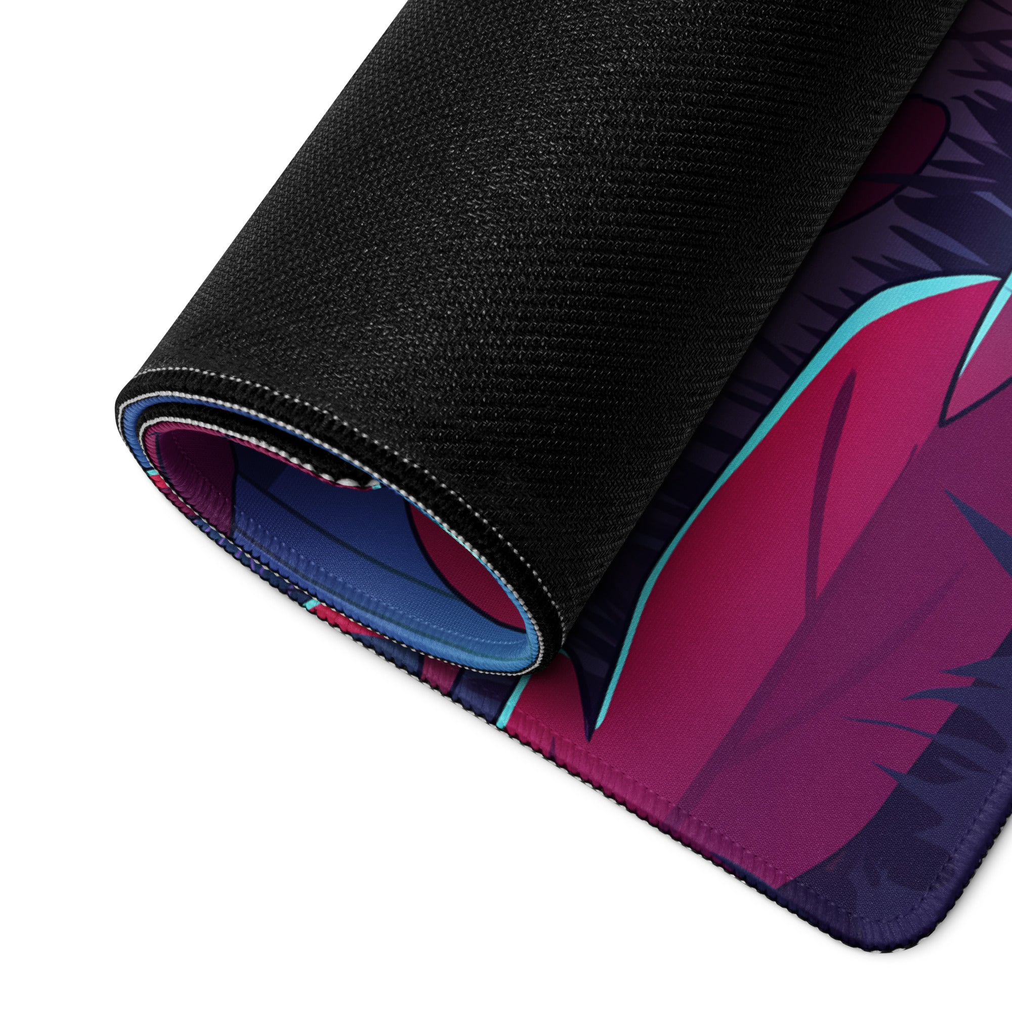 A rolled-up neon ghost vaporwave desk mat with vibrant anime design in magenta purple teal on black textured surface