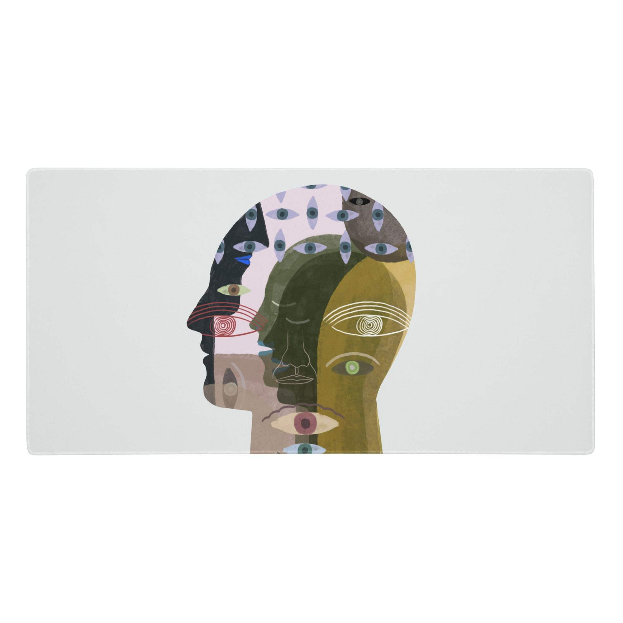 Colorful head collage desk pad featuring a vibrant abstract human head silhouette with layered multicolor eye motifs