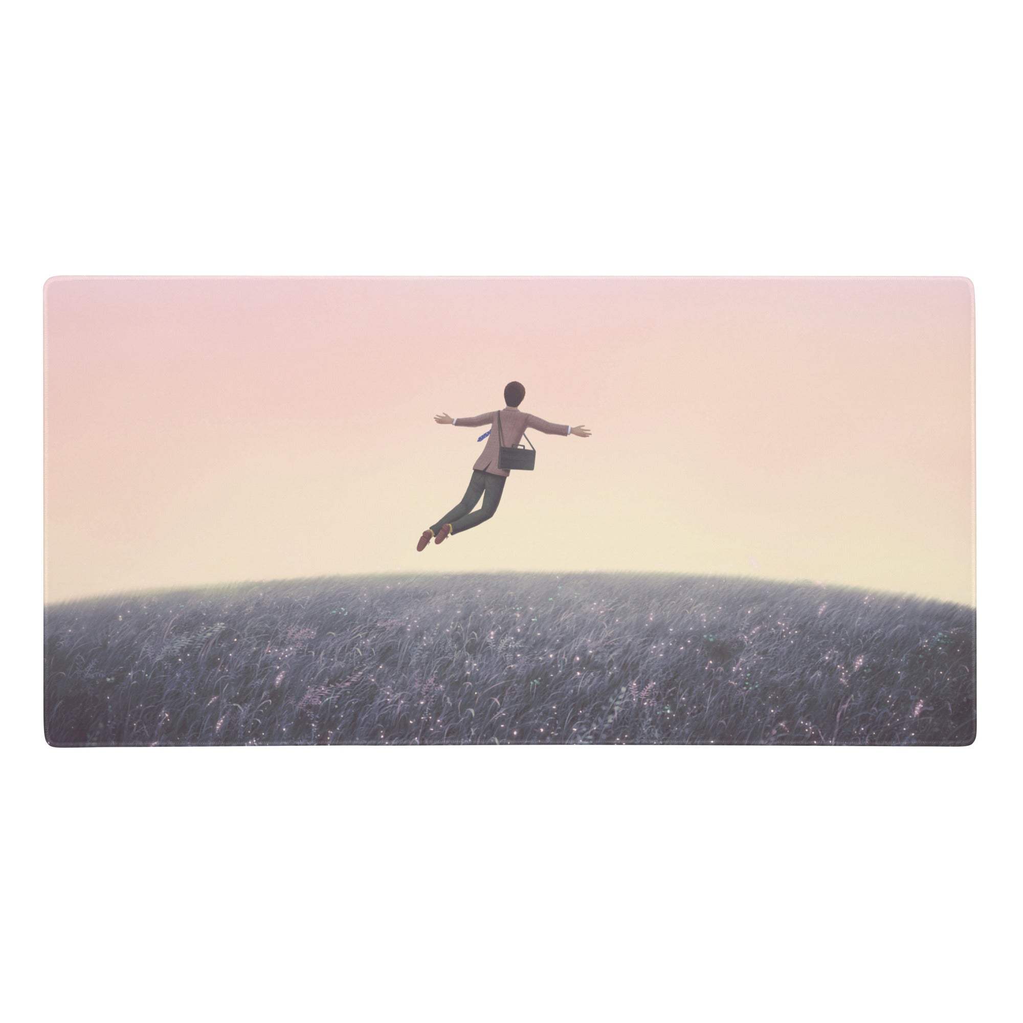 Rectangular pink gradient desk pad mouse pad with a serene mid-air person above a field under soft pastel sky