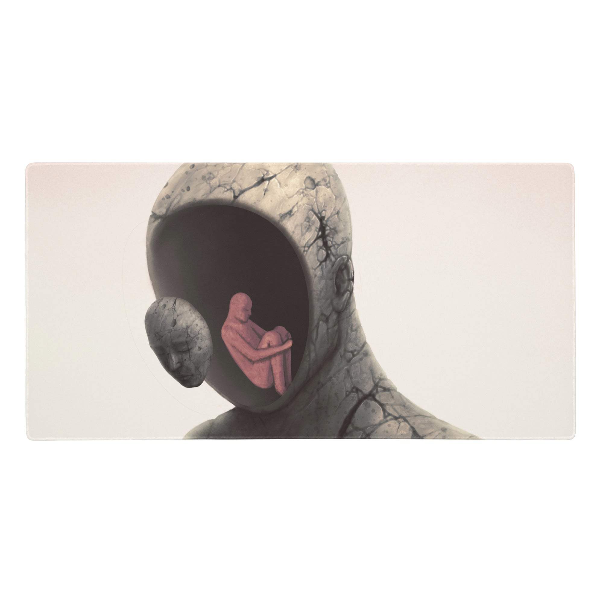 Abstract hooded figure desk pad featuring a cracked gray stone head sculpture with a hollow interior and a pink figure inside