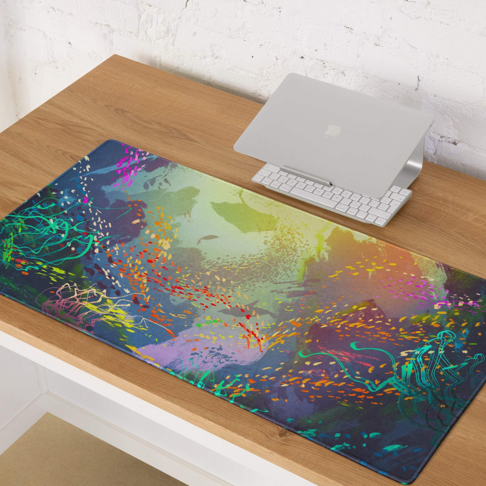 Vibrant splash abstract gaming mousepad with glossy finish featuring teal magenta gold and purple paint splatter on dark blue