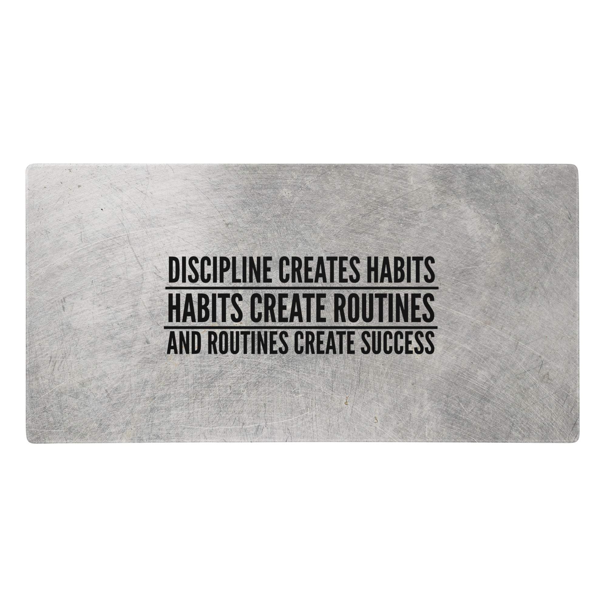 Silver metallic rectangular desk pad with brushed finish and black motivational typography for office and gaming use