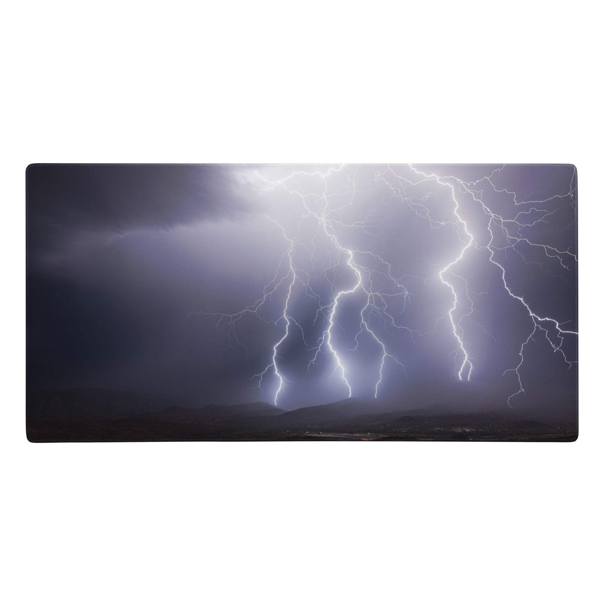 Rectangular storm lightning pro gaming pad with vivid white and purple lightning on dark gray desktop setup