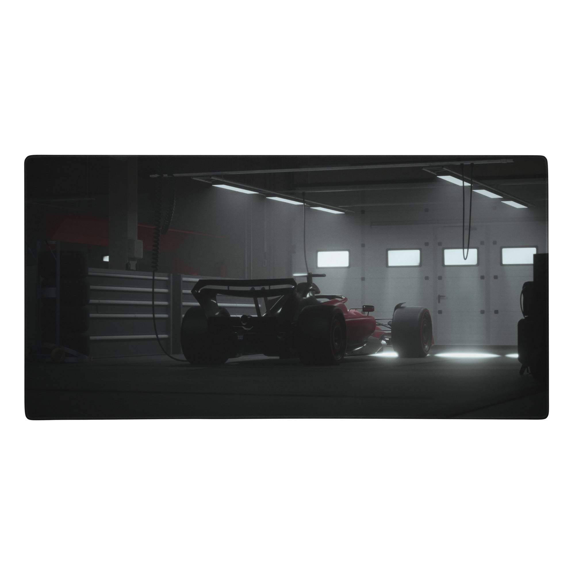 Red formula 1 race car parked in dim garage on elite large black gaming mouse pad with non slip textile surface