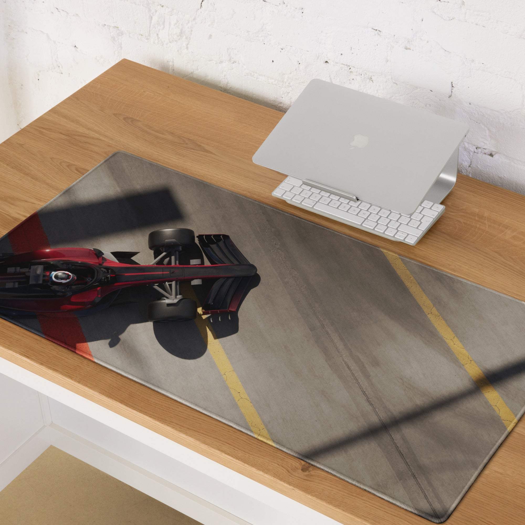 Red and black formula 1 race car graphic printed on a sleek glossy rectangular desk mat for gaming and esports use