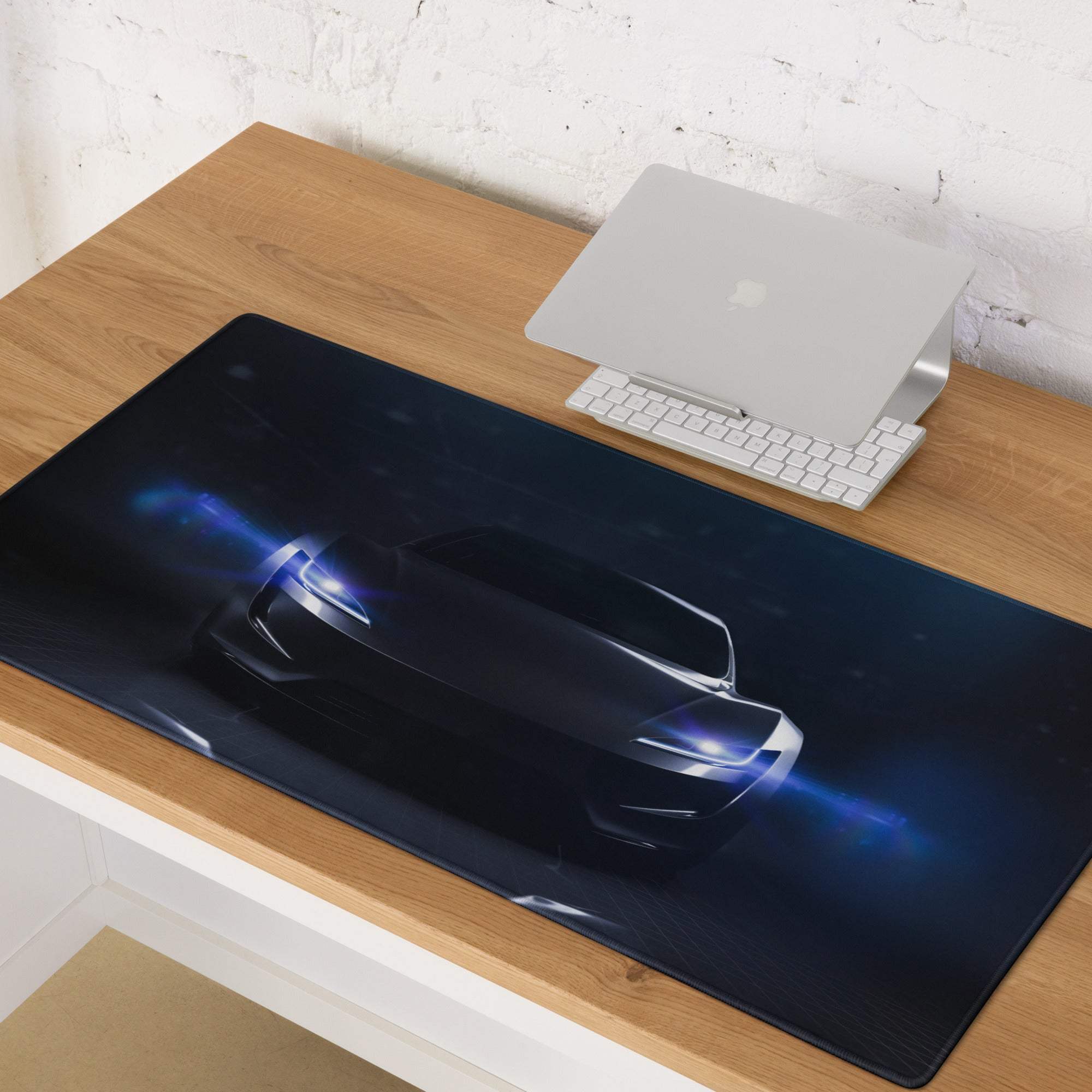 Black gaming mouse pad featuring a glossy futuristic car graphic with glowing blue headlights and underglow design