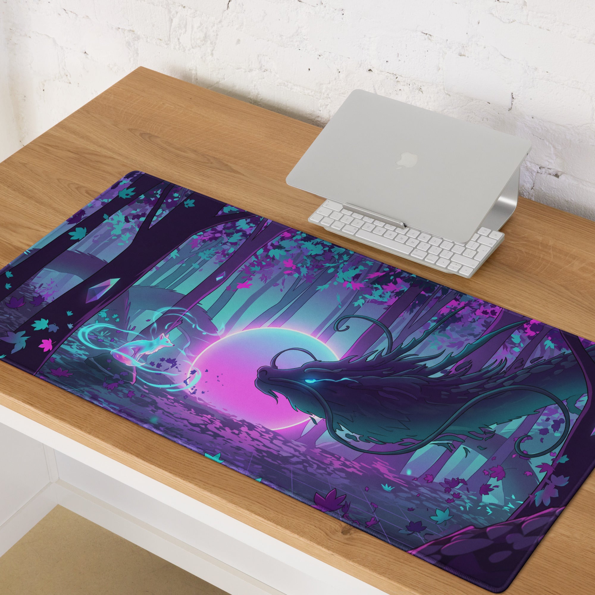 A vibrant purple and teal dragon-themed gaming mouse pad with glowing neon moon on wooden desk beside laptop