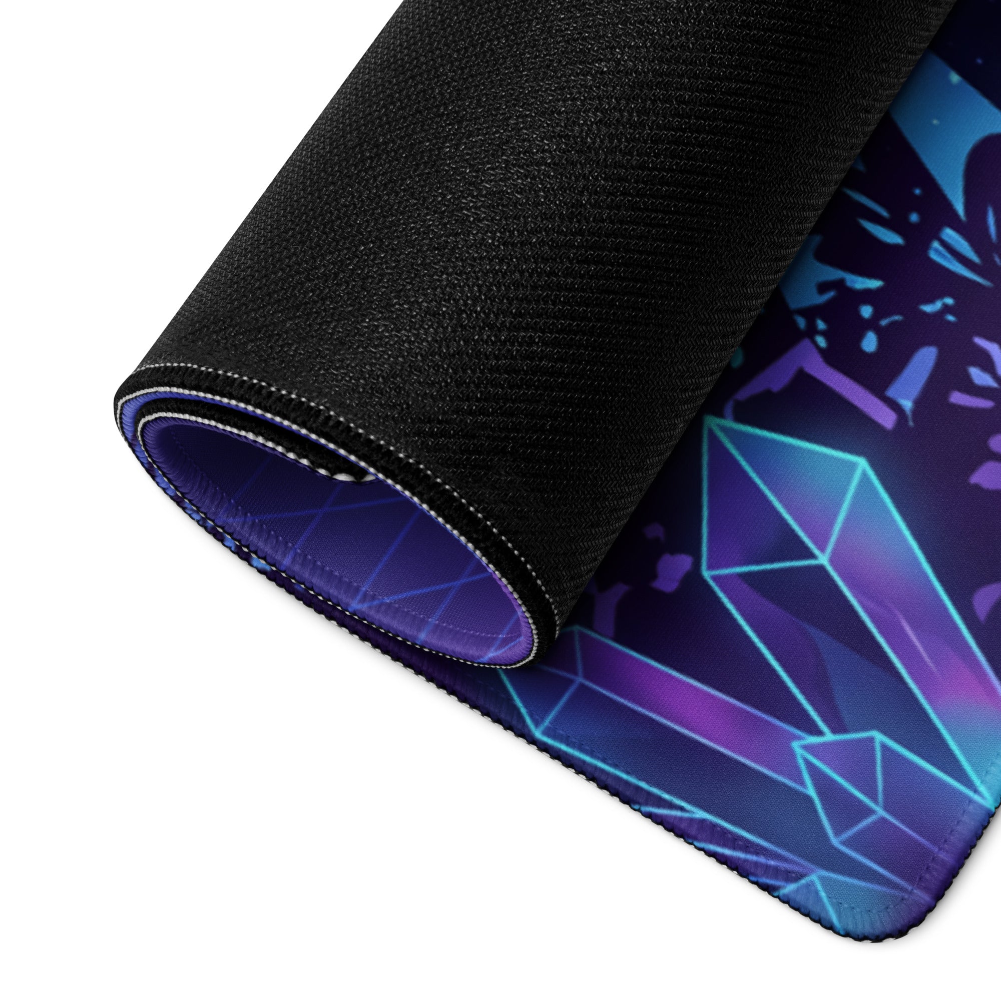 A rolled-up vaporwave night city gaming mouse pad with vibrant purple blue crystal design and black fabric edges
