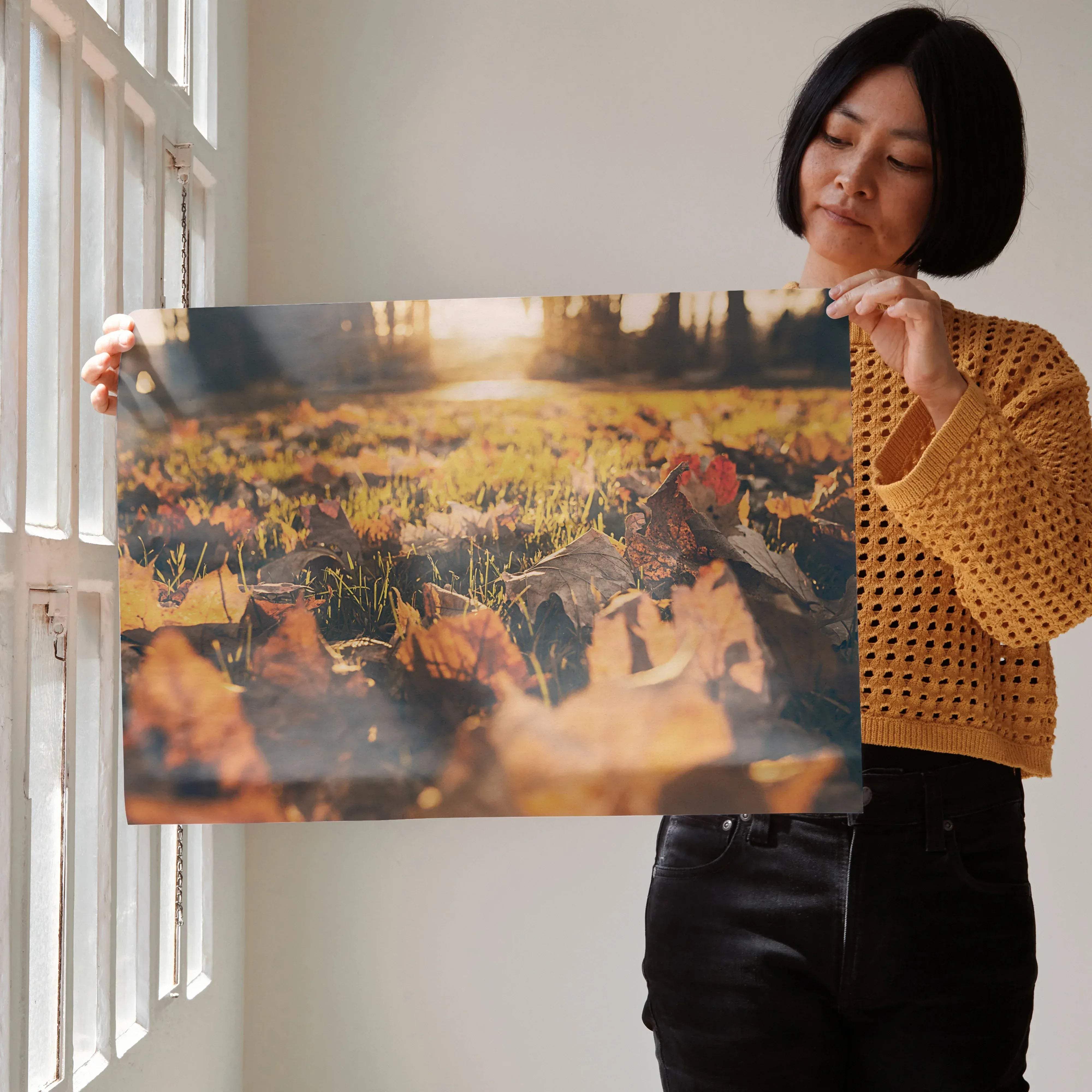 A rectangular canvas print featuring a warm golden fallen autumn leaves field under soft sunlight vibrant autumn leaves poster