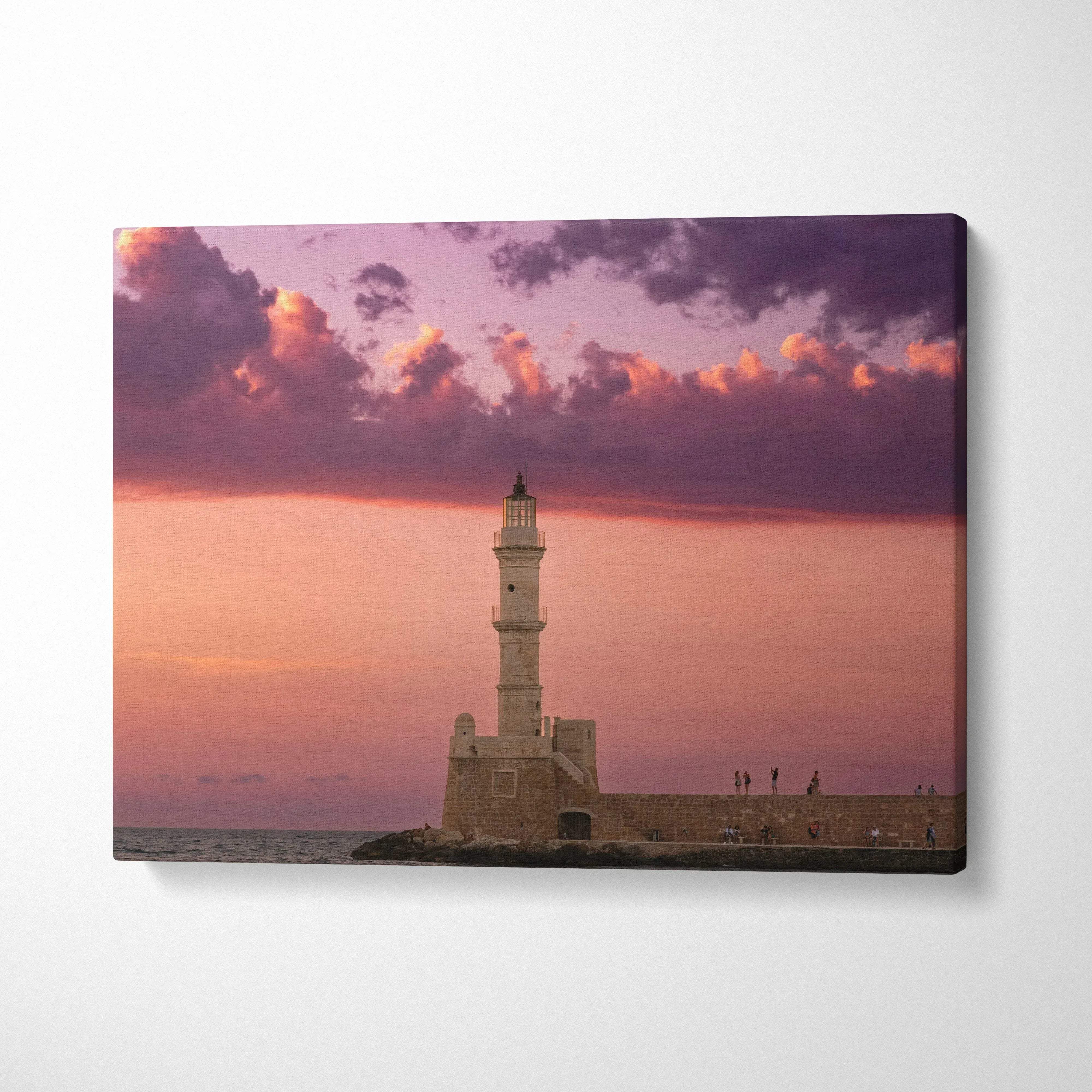 Canvas wall art featuring a lighthouse at sunset with purple and orange sky tones.