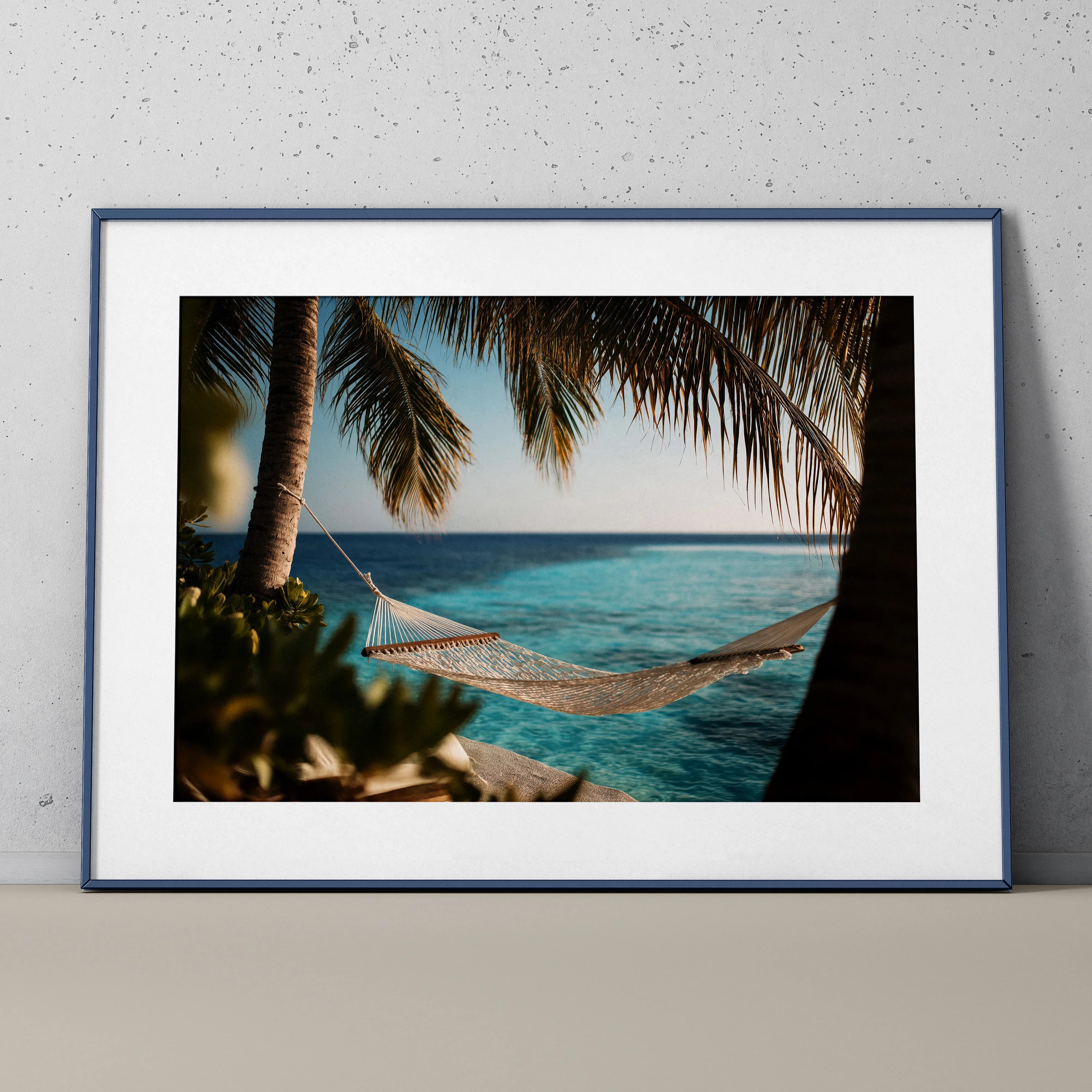 Framed digital art poster of a hammock between palm trees over clear ocean water wall art.