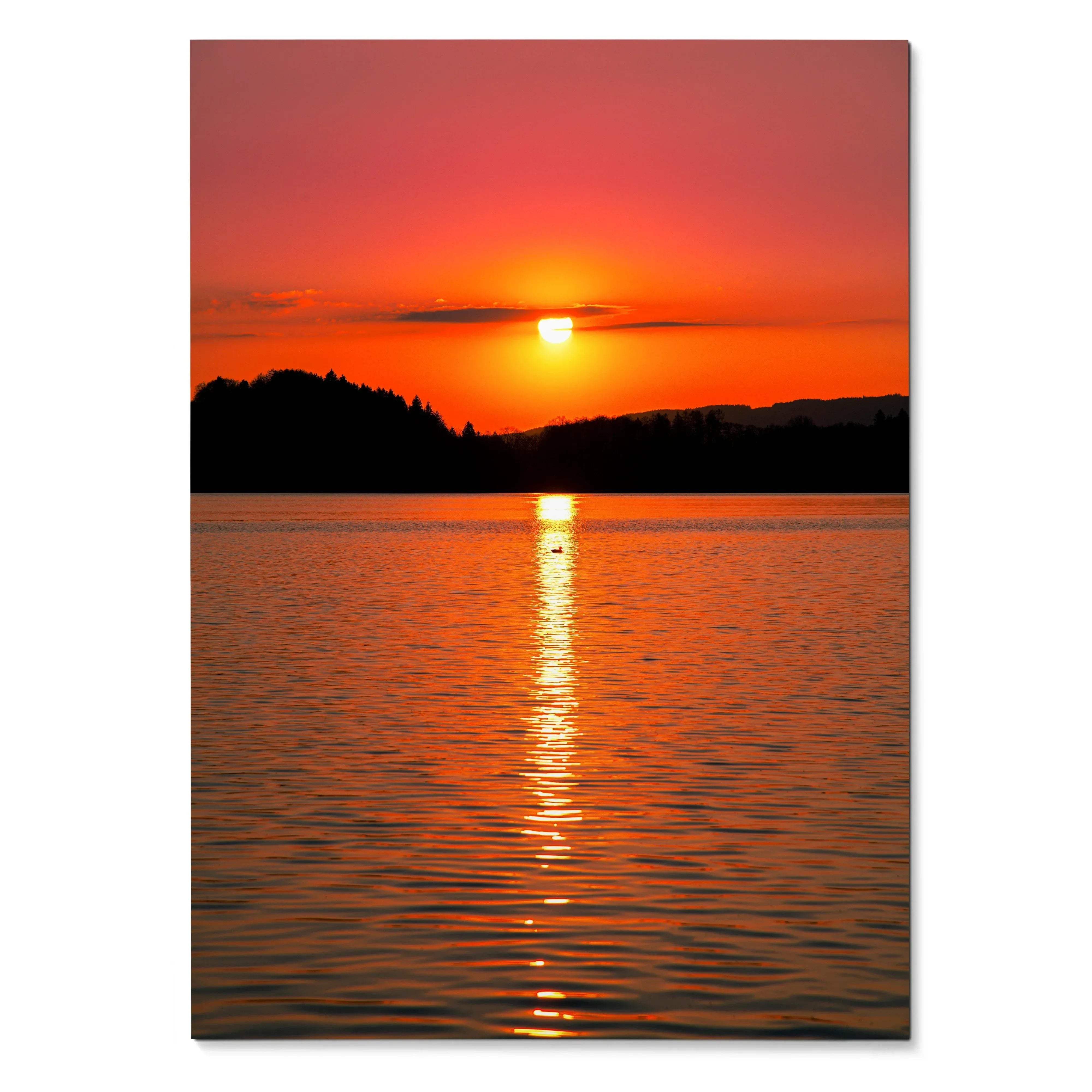 Vertical poster wall art of vibrant orange and red sunset over calm ocean with silhouetted shoreline.