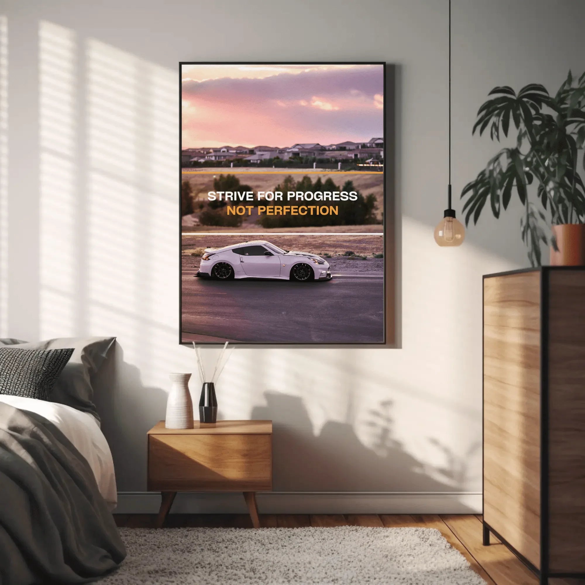 Nissan 370z motivational poster wall art with inspiring text "Strive for progress not perfection" against sunset background.