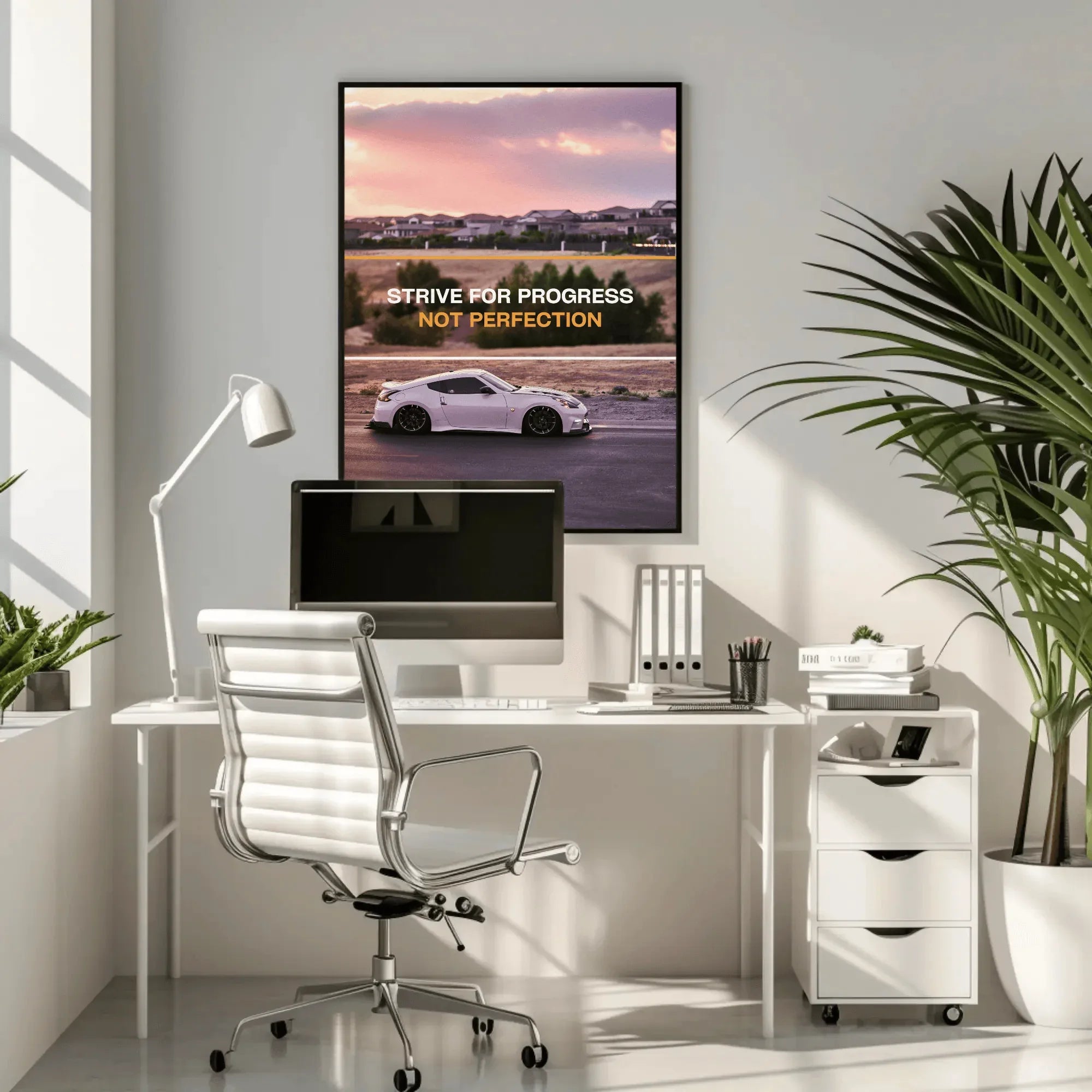 Nissan 370z motivational poster wall art with sunset and inspiring text in modern office setting.