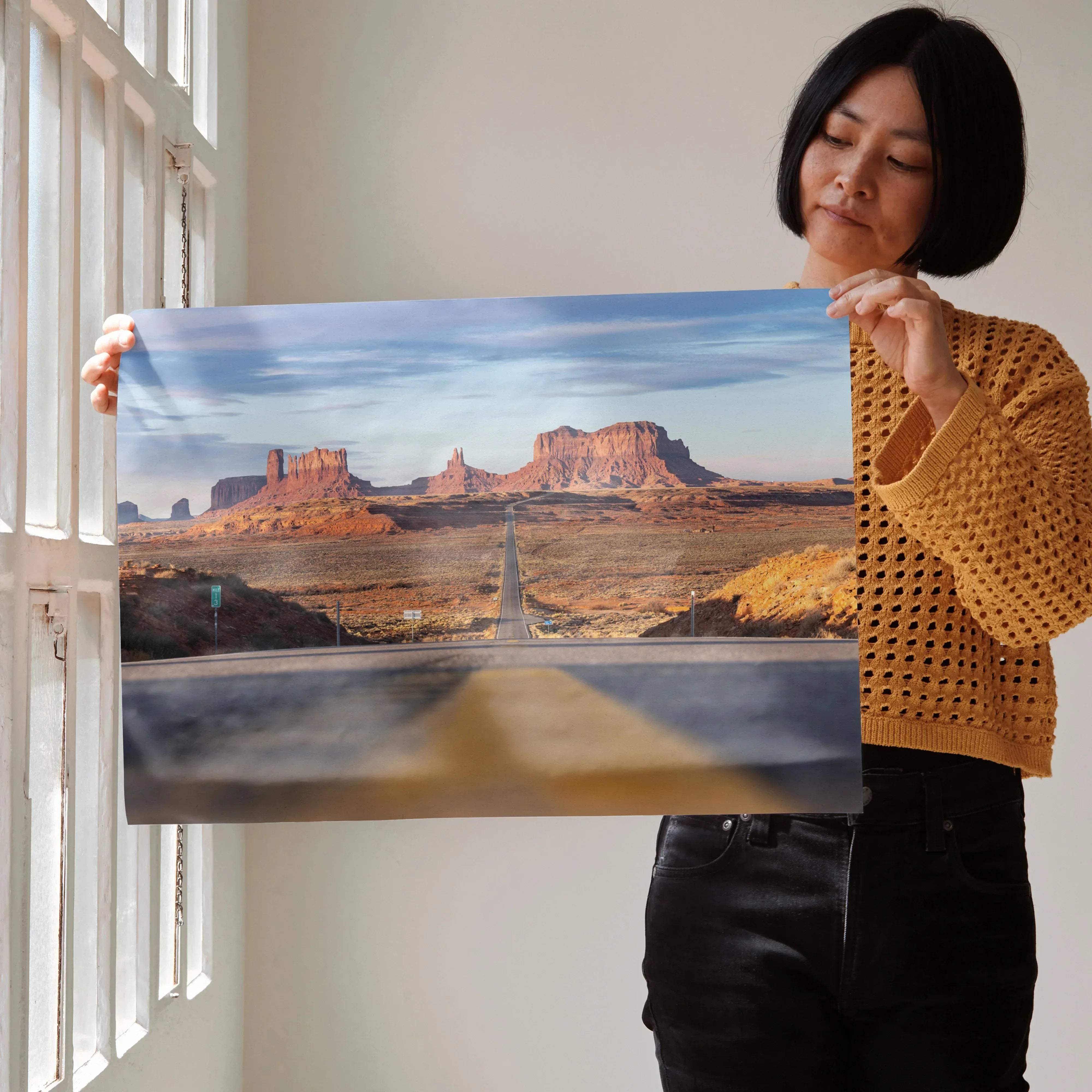 Majestic mountain landscape wall art poster featuring a high-resolution print of red rock desert with a road under cloudy sky