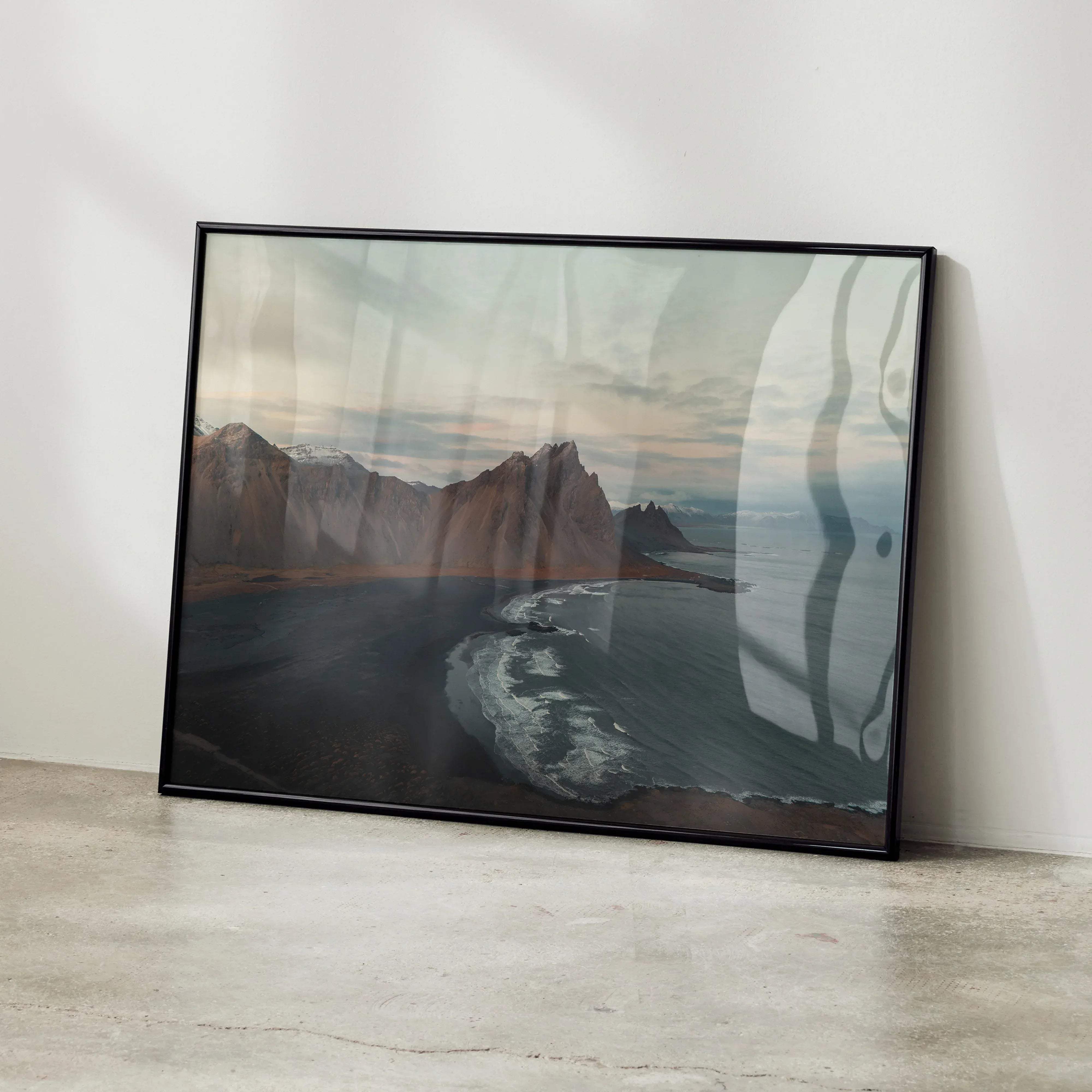 Majestic mountain nature art print wall decor featuring black-framed rugged mountains and dark textured shoreline