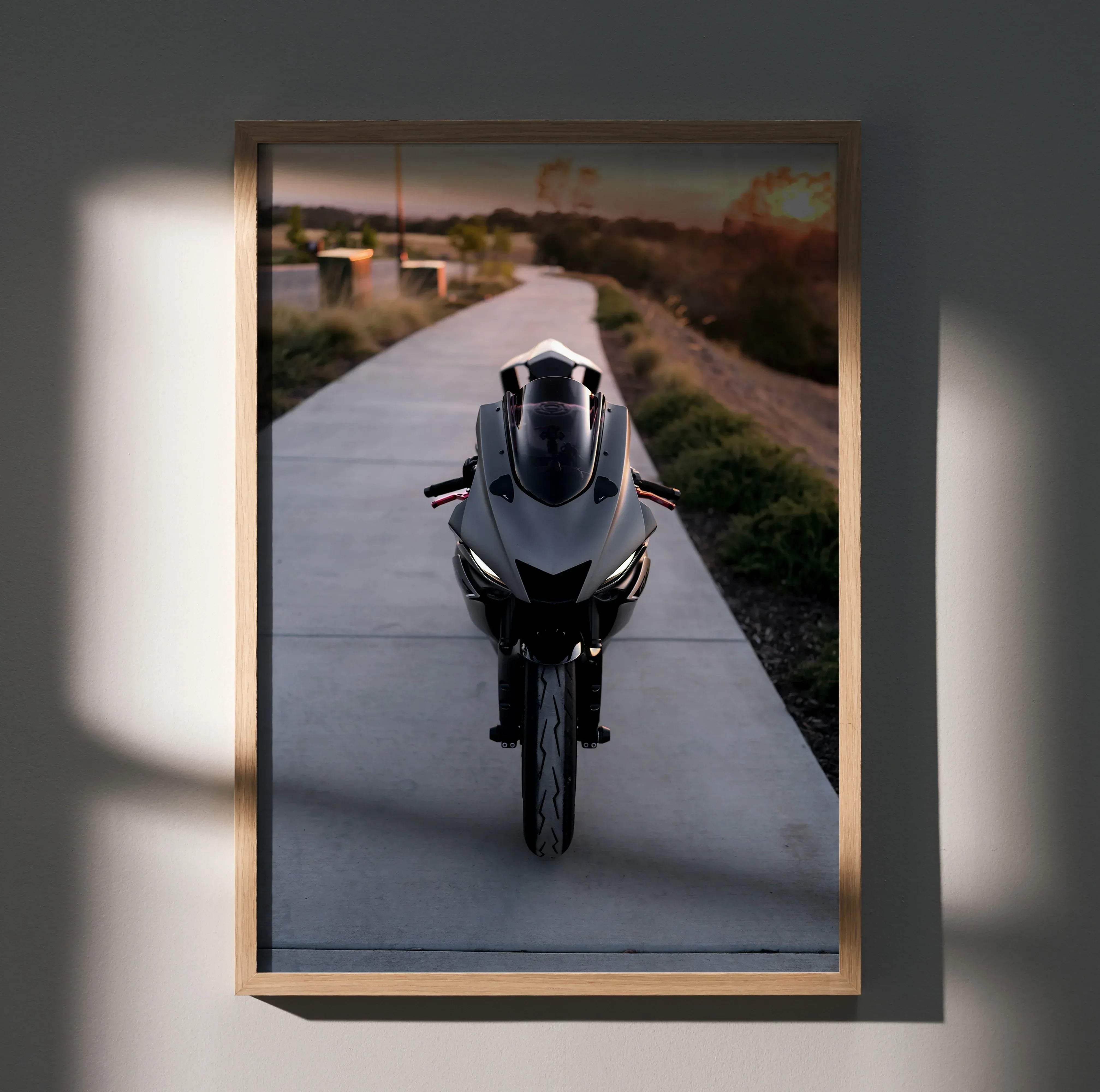 A sleek silver and black yamaha r6 sport motorcycle rear view with glowing headlights in a light wood frame poster