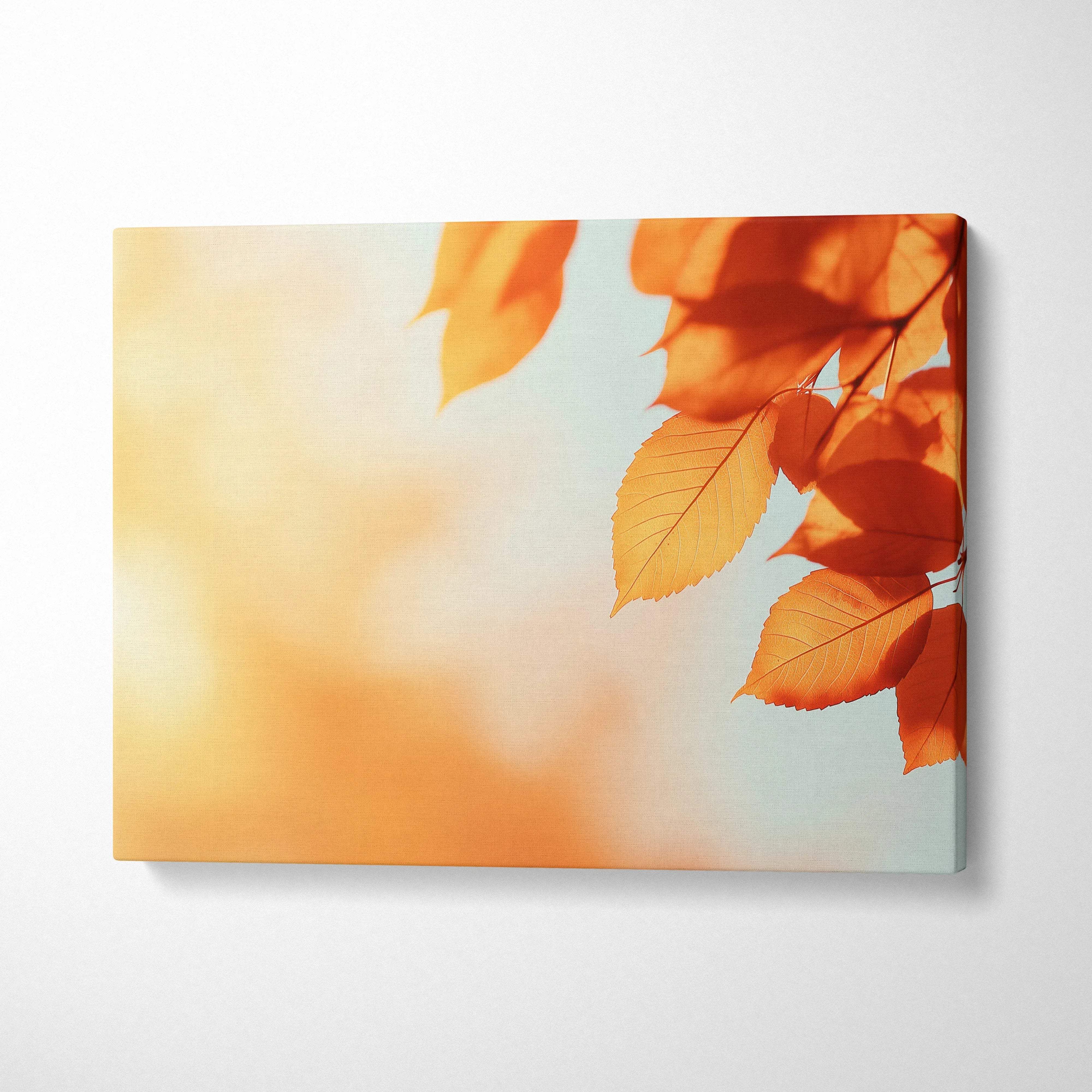 Canvas wall art featuring vibrant orange autumn leaves against a soft blue and warm glowing background.