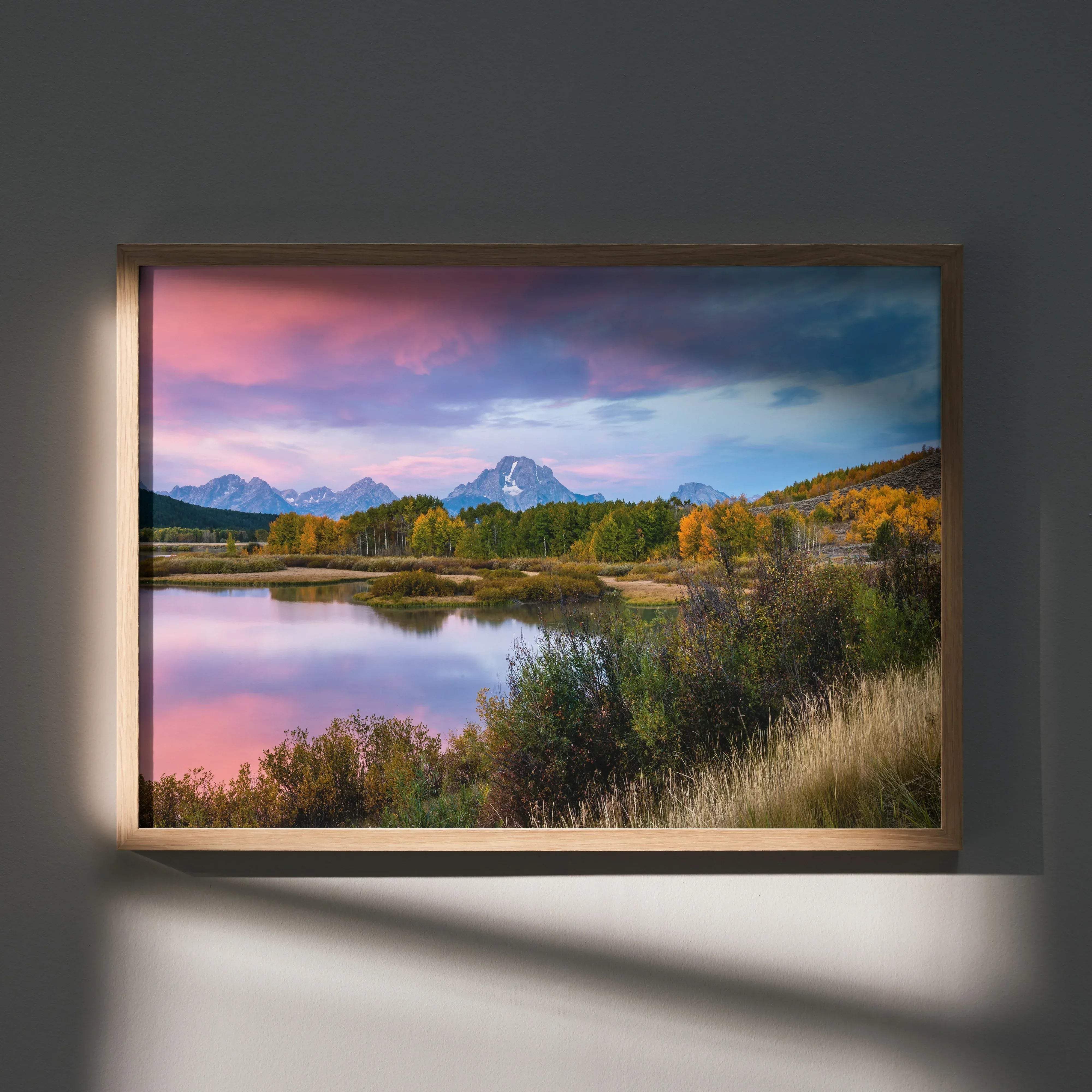 Stunning mountain sunset poster wall art featuring a serene pink and purple lake landscape with autumn trees and snow peaks