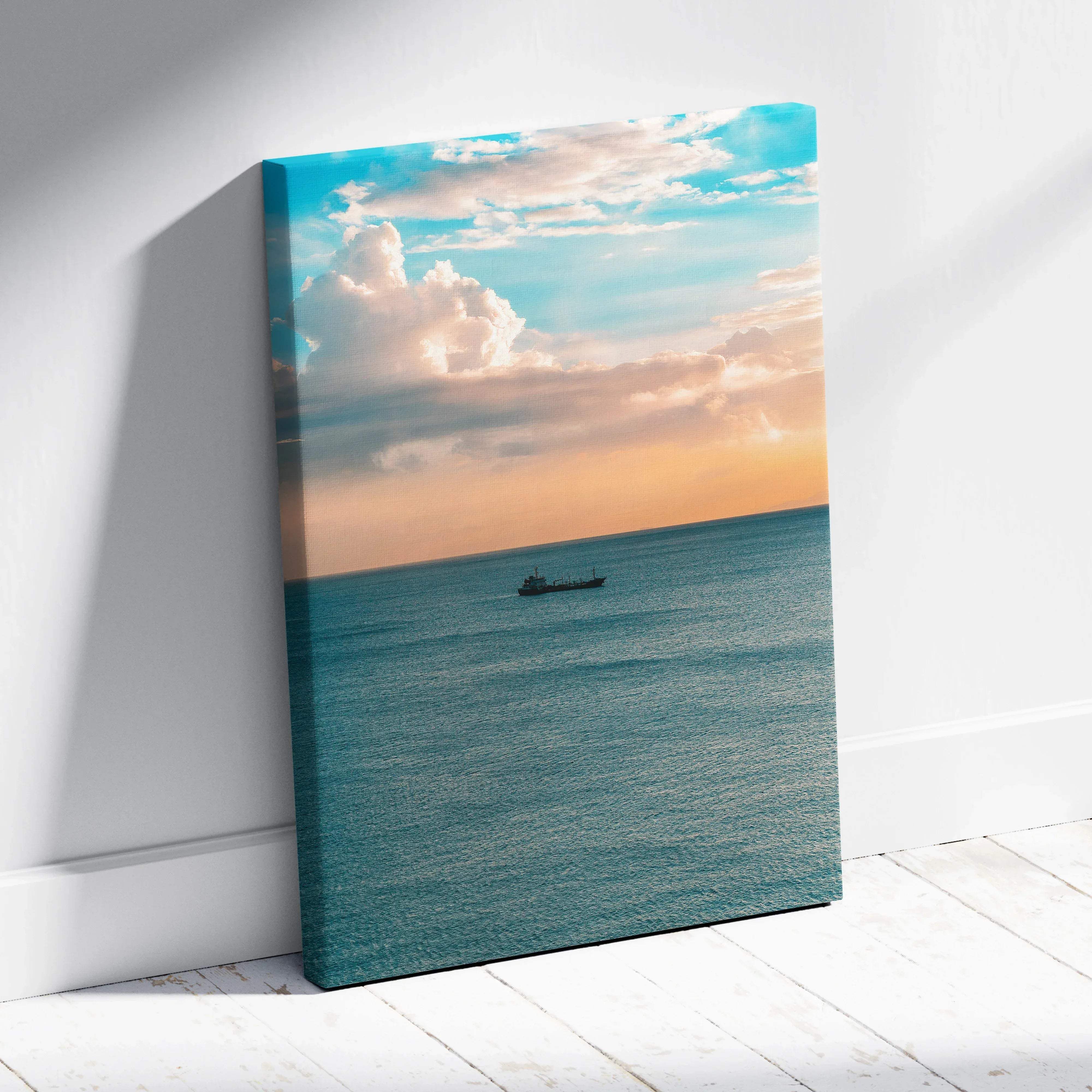 Calm seascape rectangular canvas wall art featuring a serene ocean scene with soft blues and peach tones and a boat