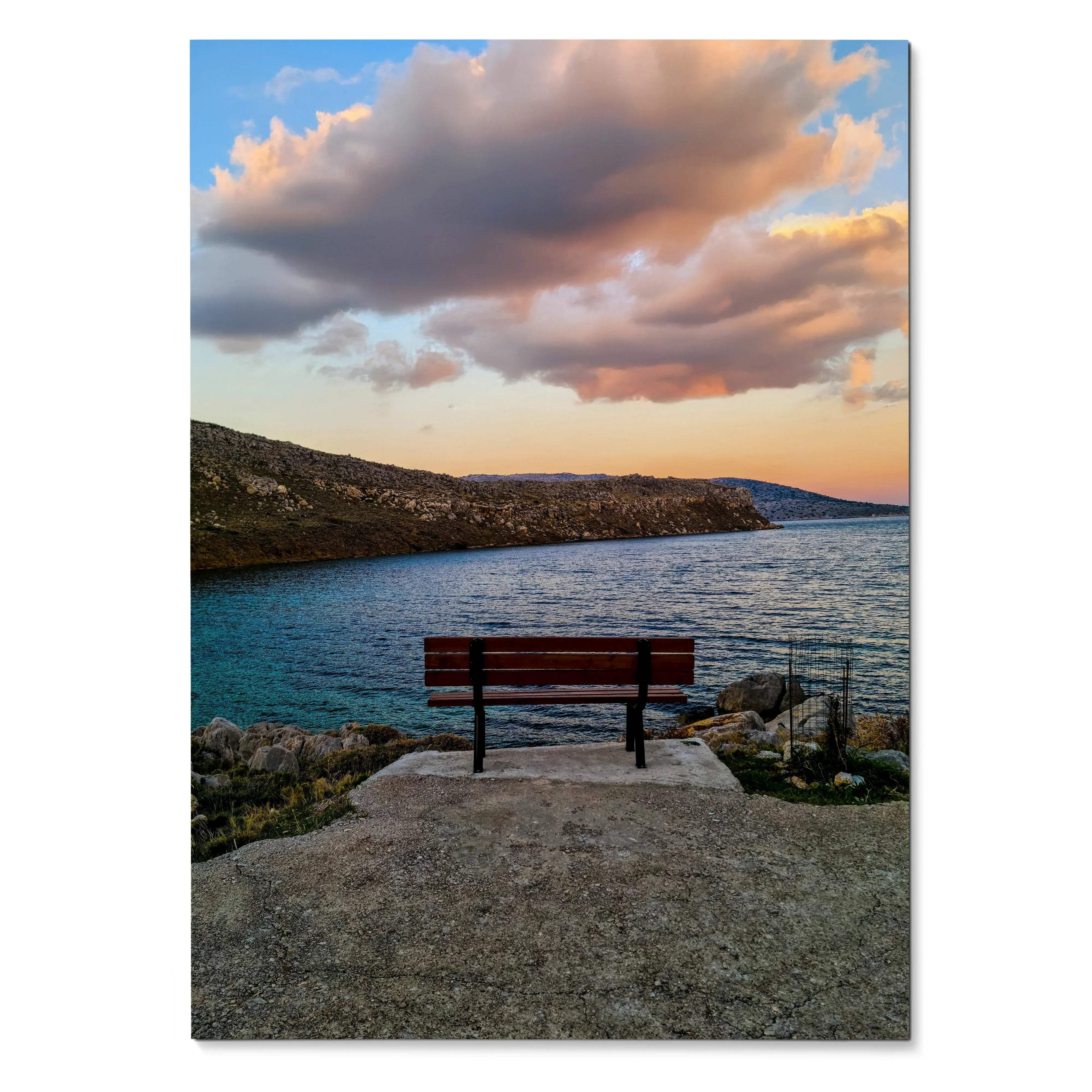 Vibrant sunset landscape poster featuring a bench overlooking a rocky coastline and calm water wall art.
