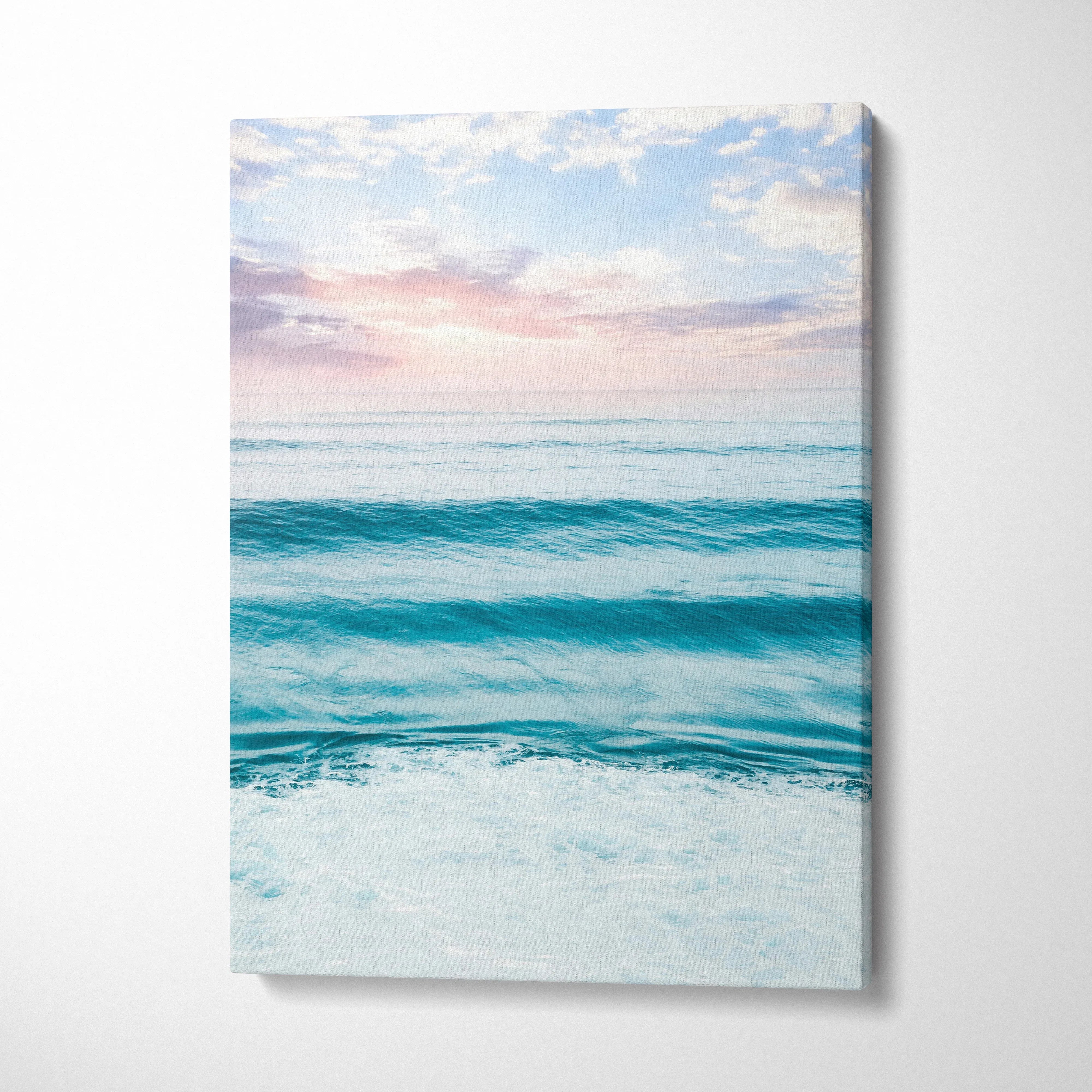Vertical canvas wall art featuring a serene beach sunset over calm ocean waves.