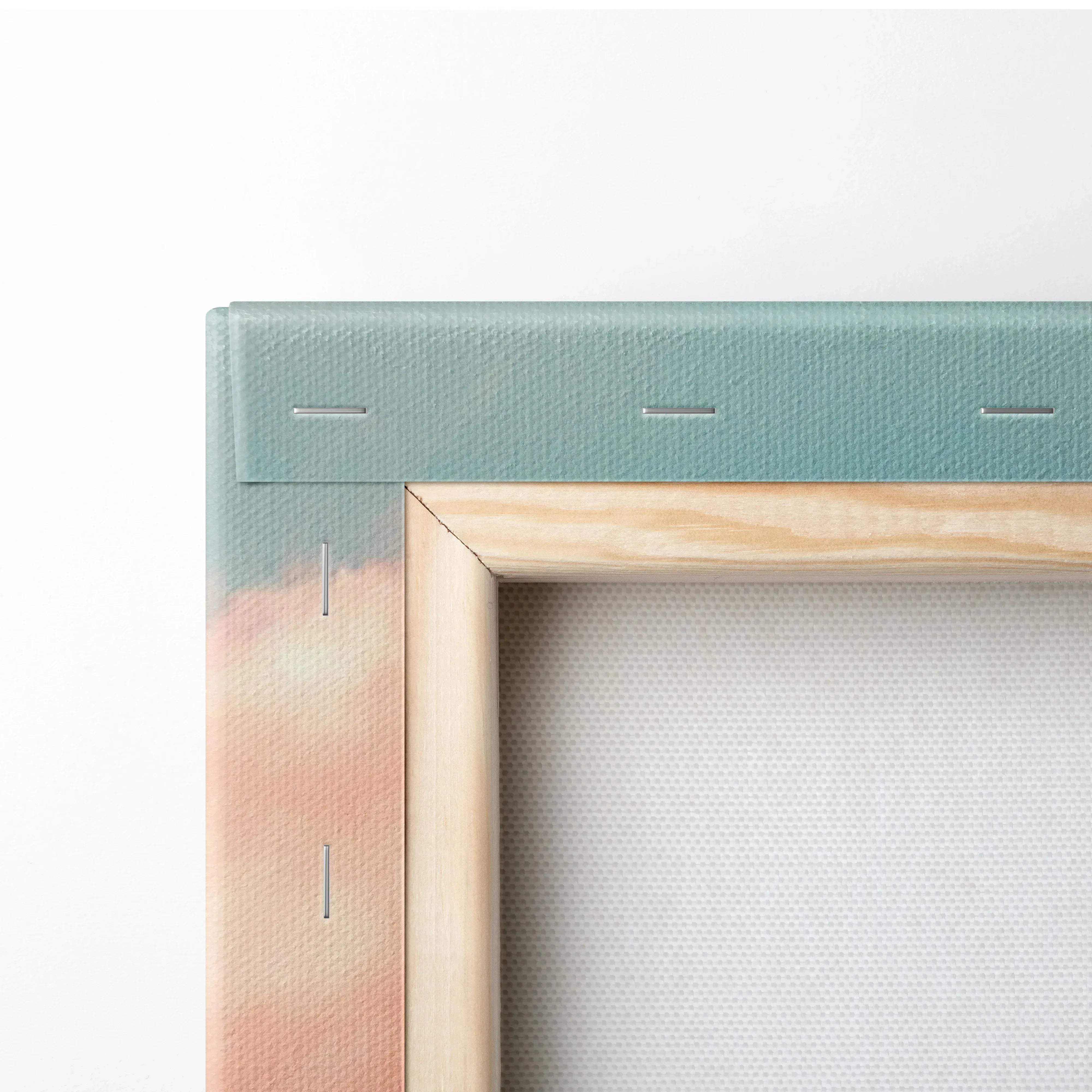 A minimalist wooden framed canvas wall art with teal and peach gradient fabric edges in a sunset coastal scene print