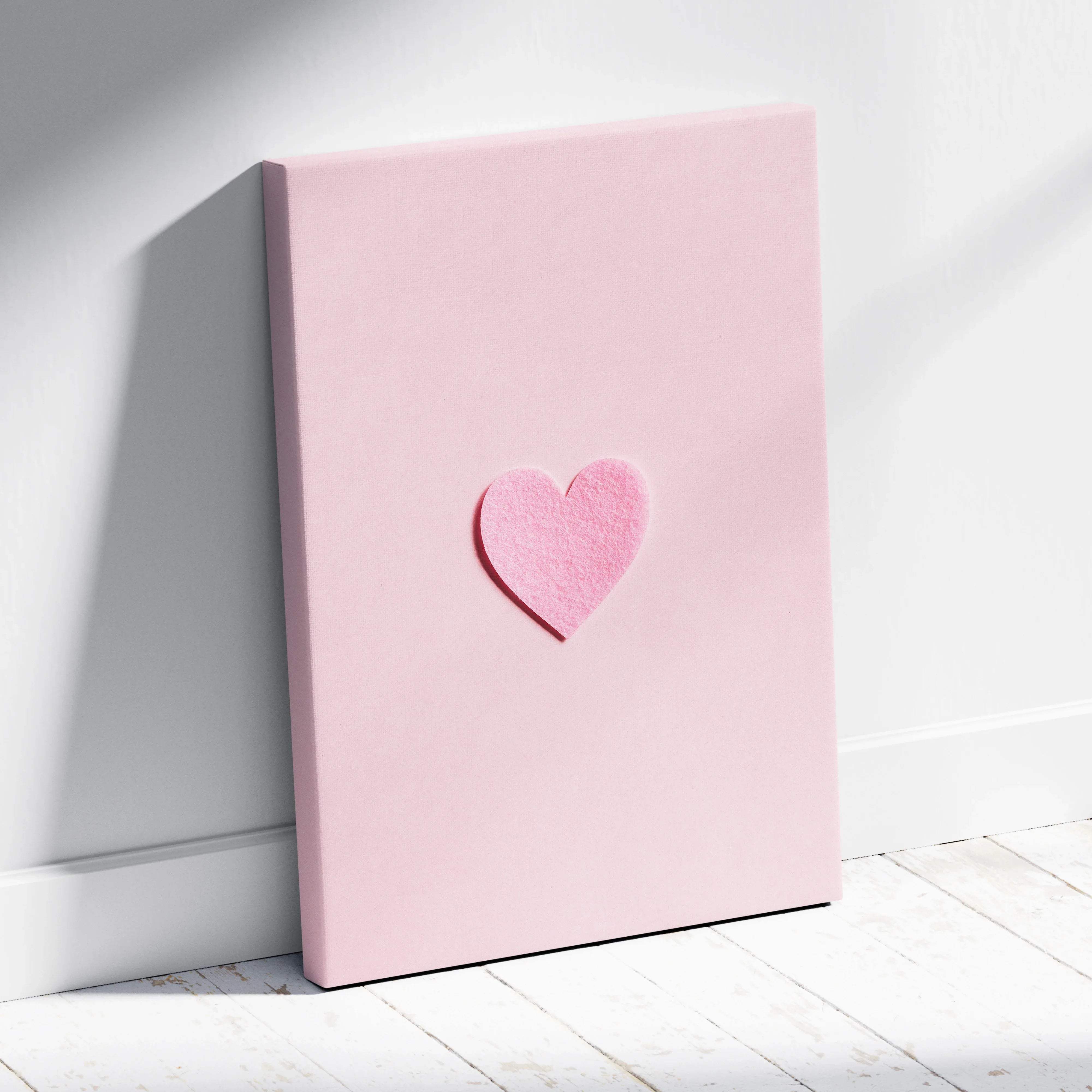 Minimal pink felt heart on pastel pink canvas wall art flat lay