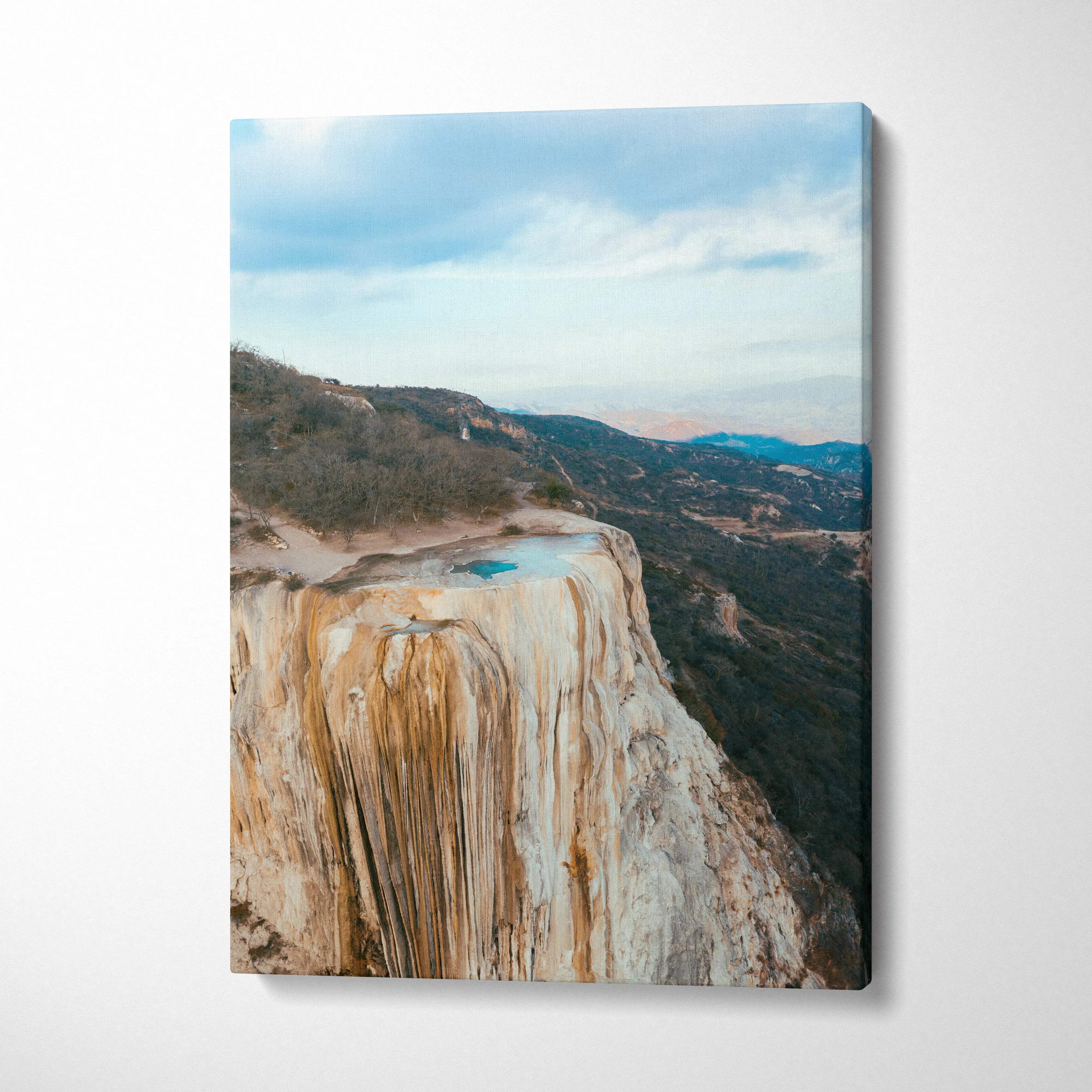 Mountain landscape with natural rock formation and blue sky on canvas wall art.