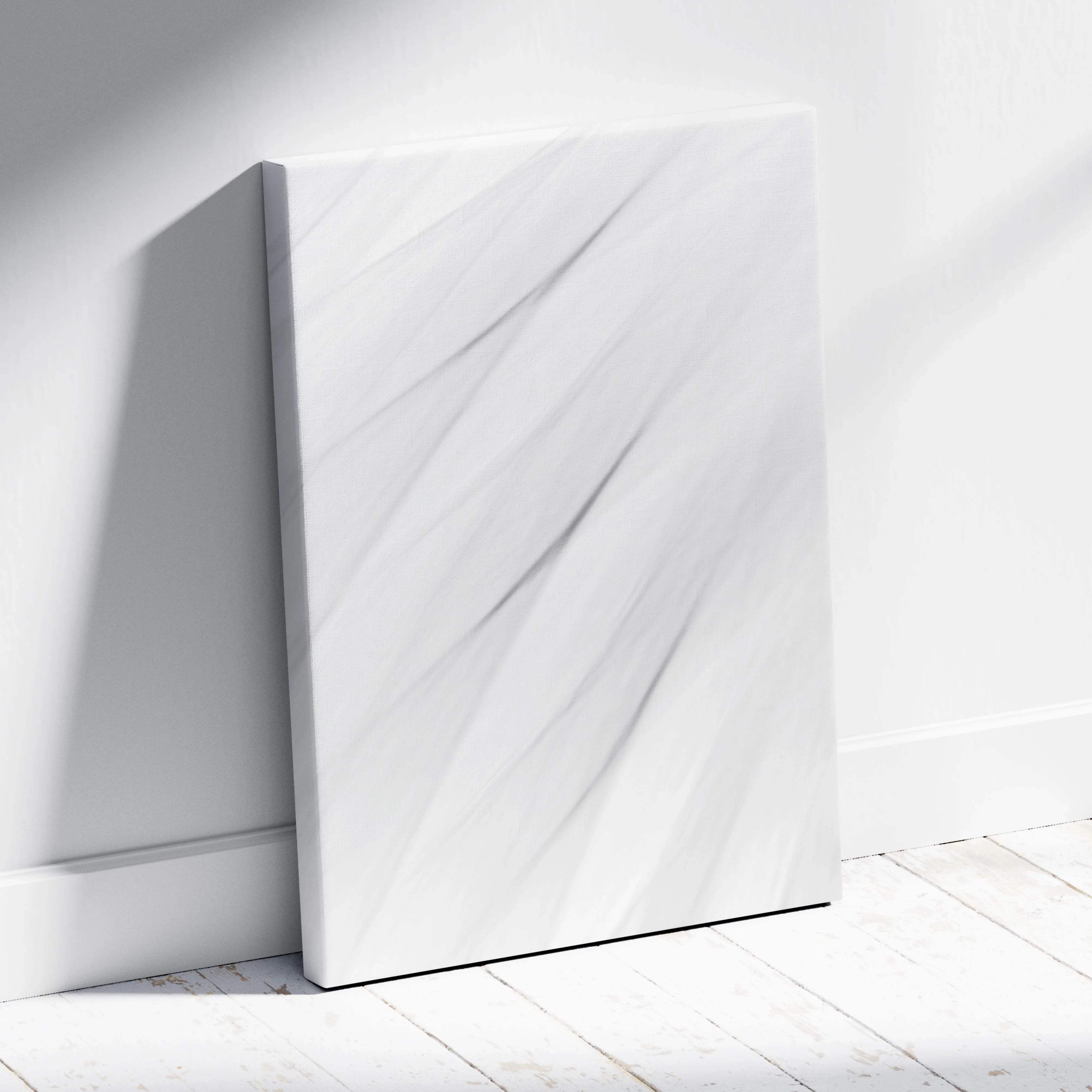 White marble textured canvas leaning against wall with gray veining