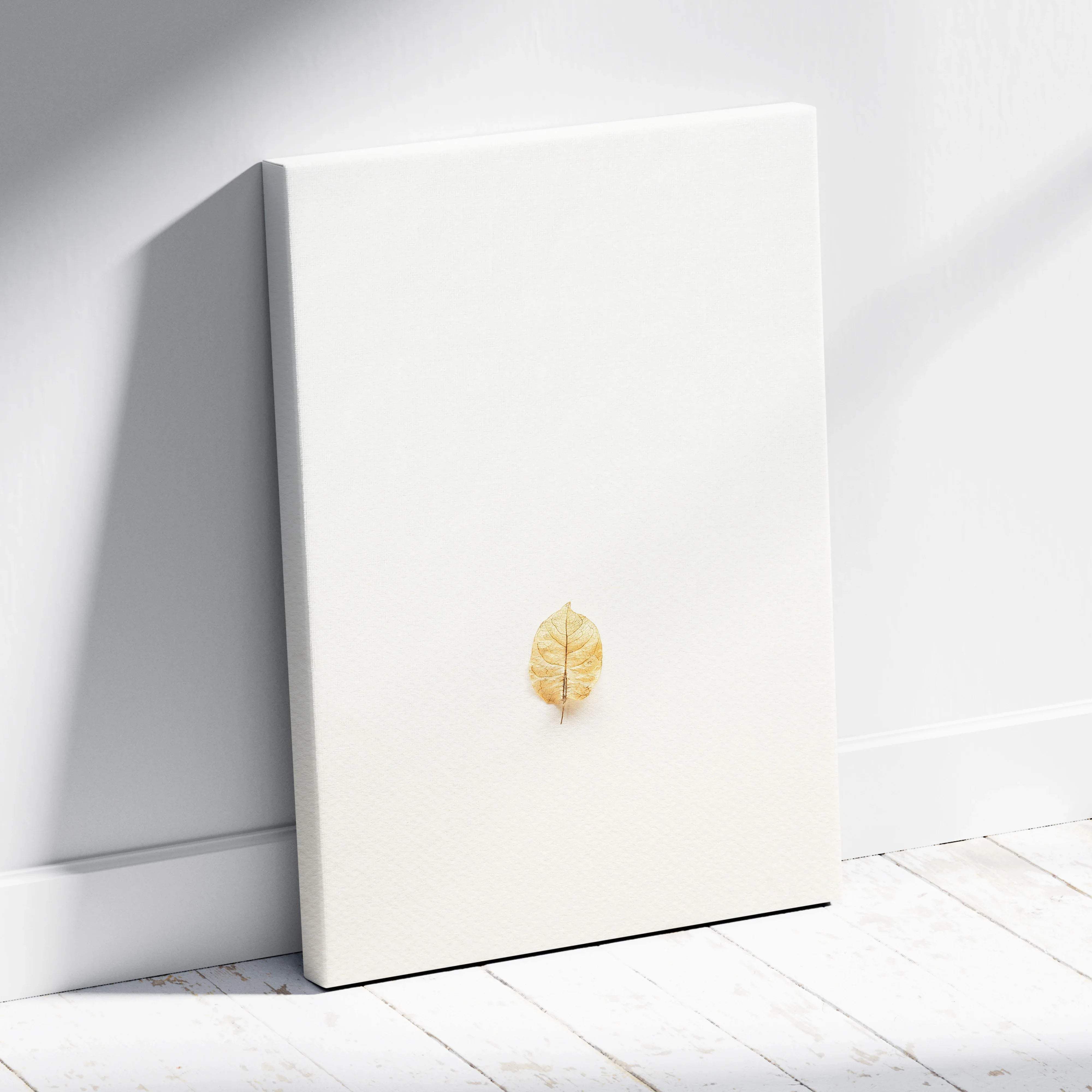 Minimalist golden leaf on white canvas wall art in neutral tones