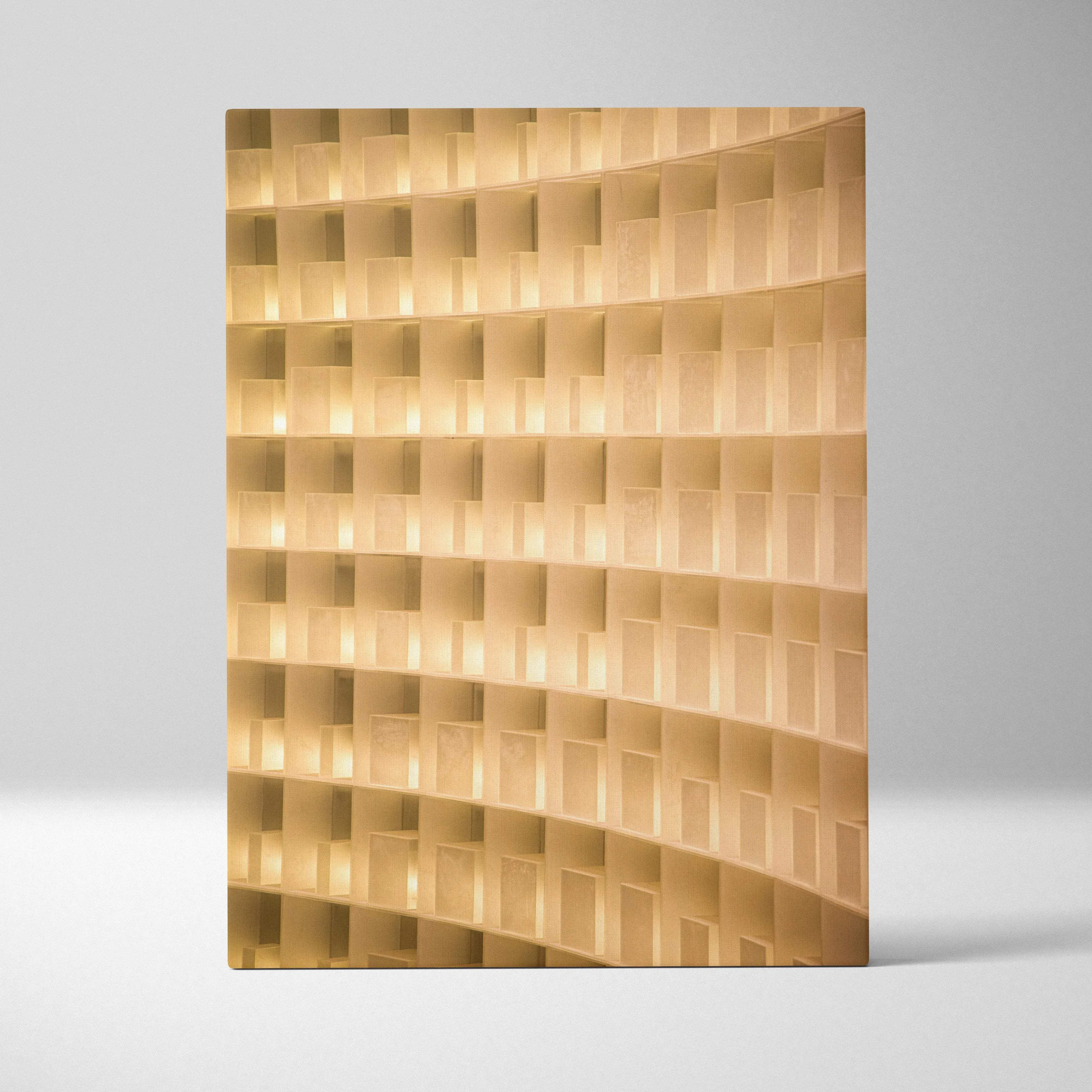 Modern curved wall light with wave-like golden geometric panels