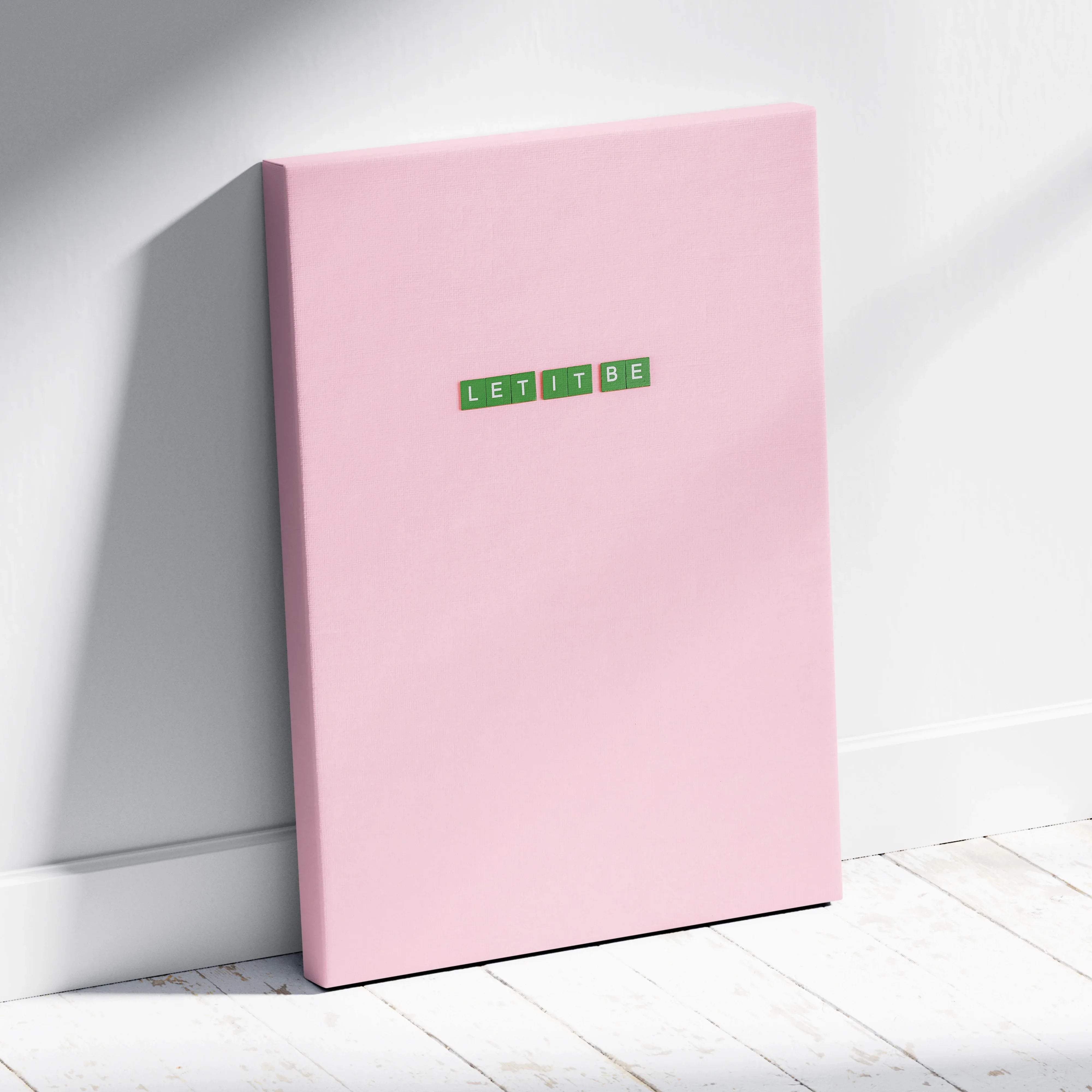 Pink canvas print with Let It Be in green Scrabble tiles