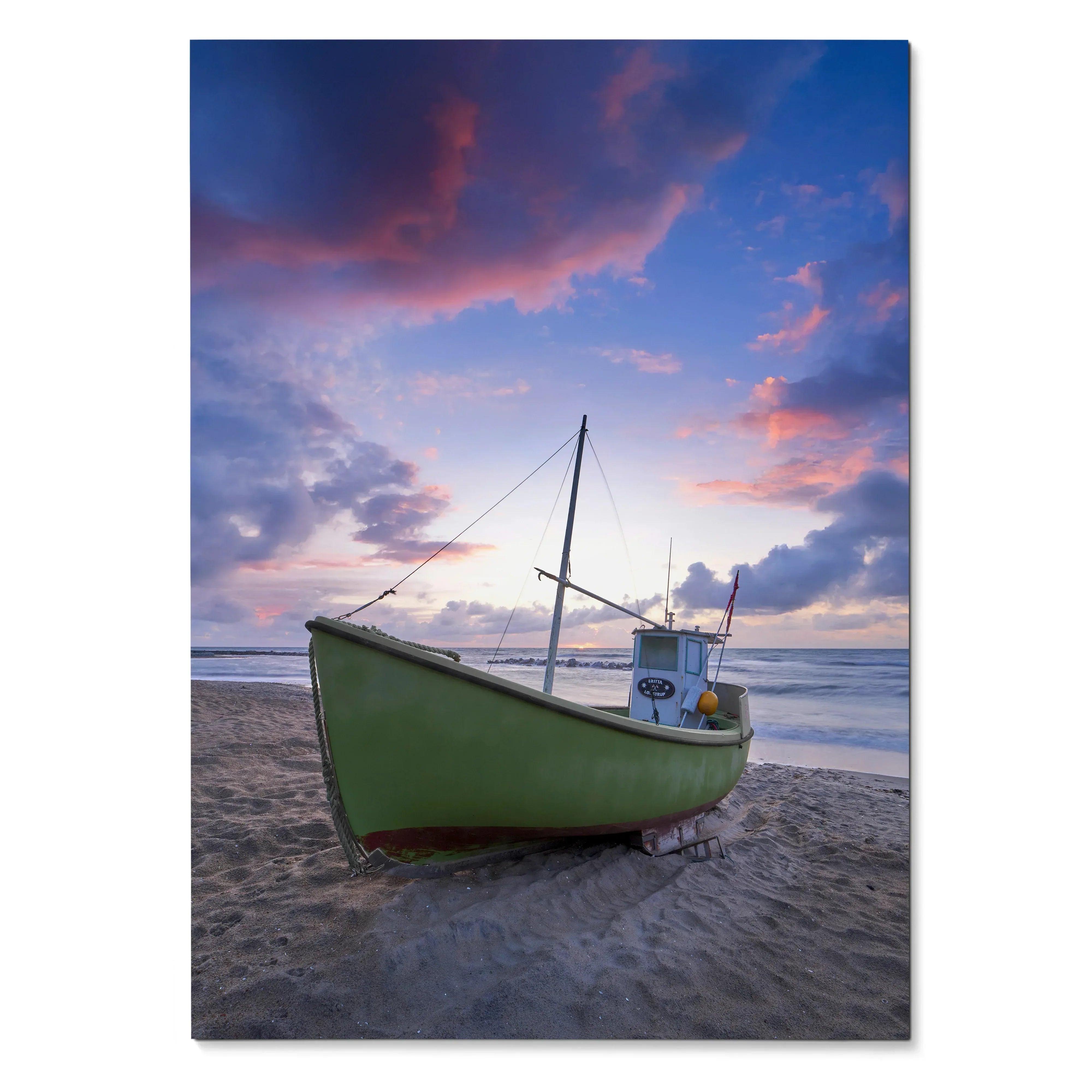 Vertical beach poster with green boat on sand beneath colorful sunset sky wall art.