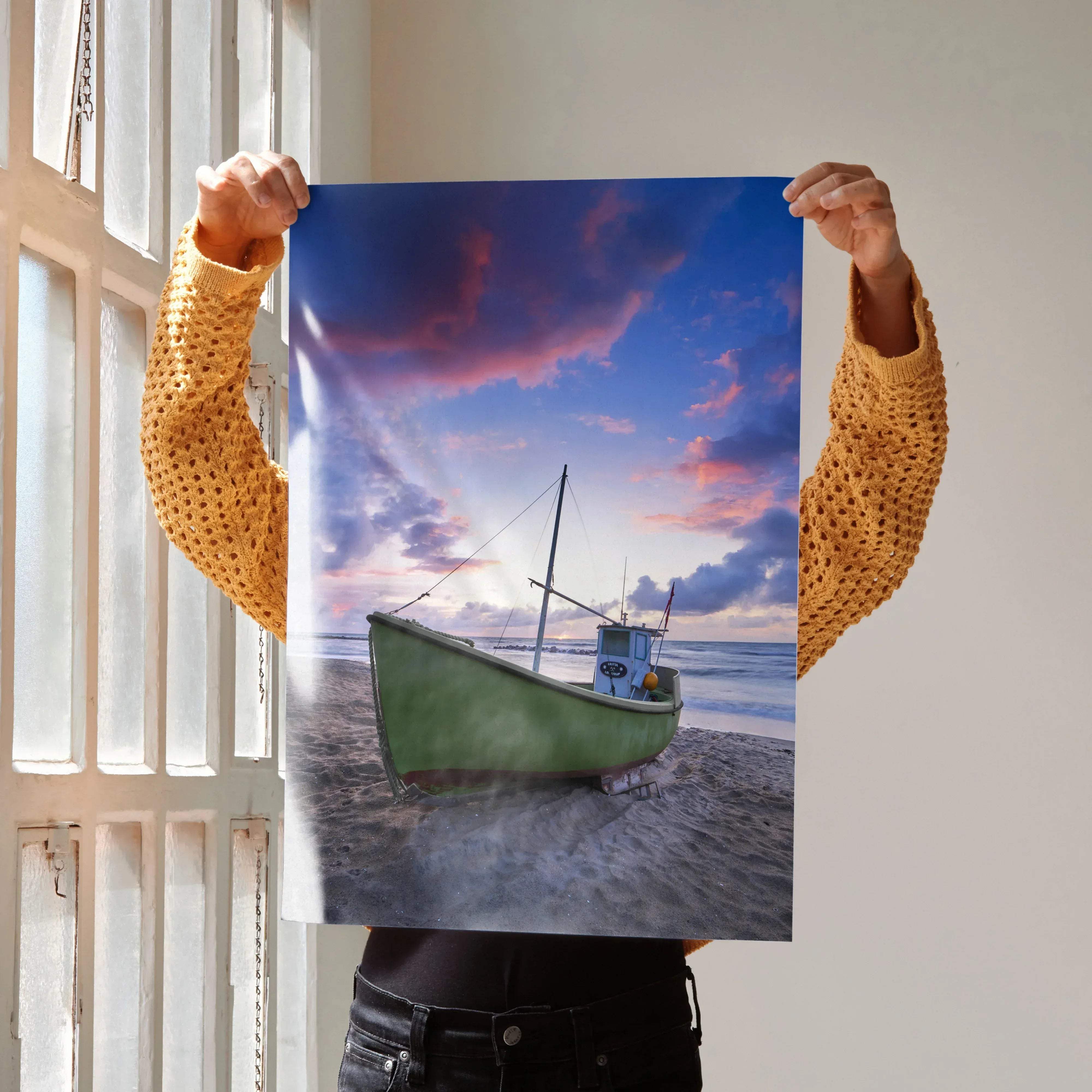 Serene beach sunset ocean art print poster featuring a green fishing boat on sandy beach under pink purple sky