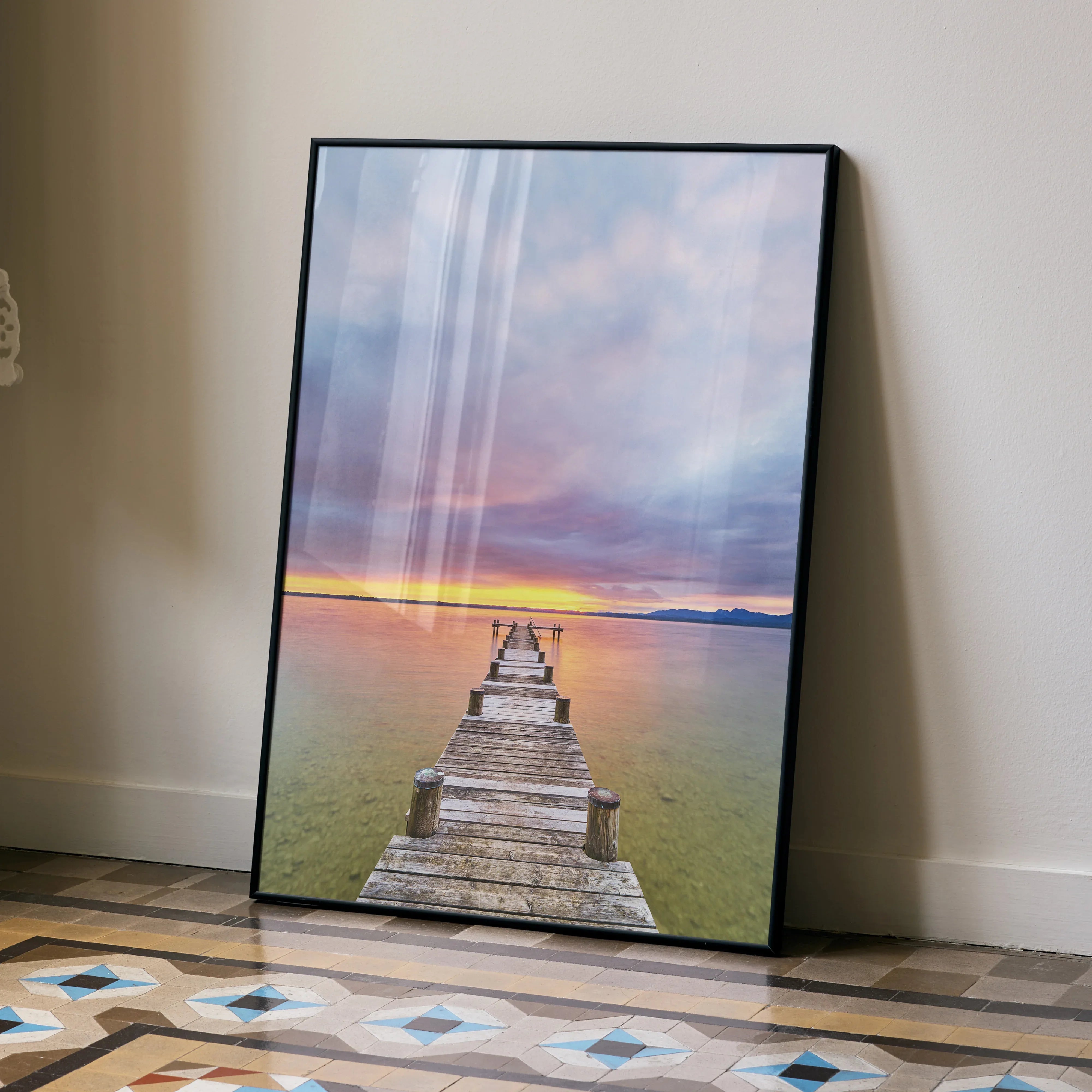 Serene beach sunset poster featuring a wooden pier extending into calm ocean under colorful sky wall art.