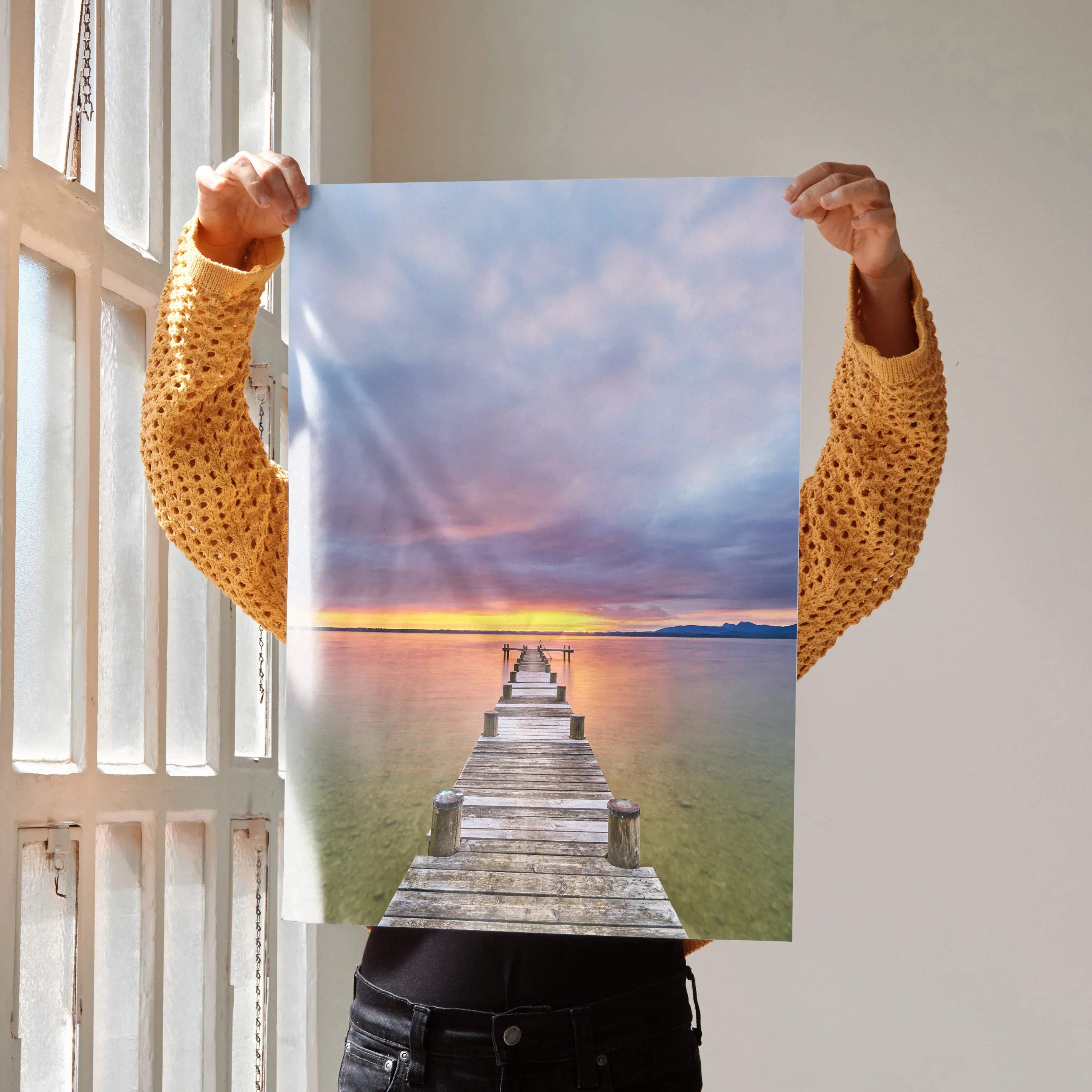 A vertical serene beach sunset ocean art print poster of a wooden pier extending into calm water under a colorful sky